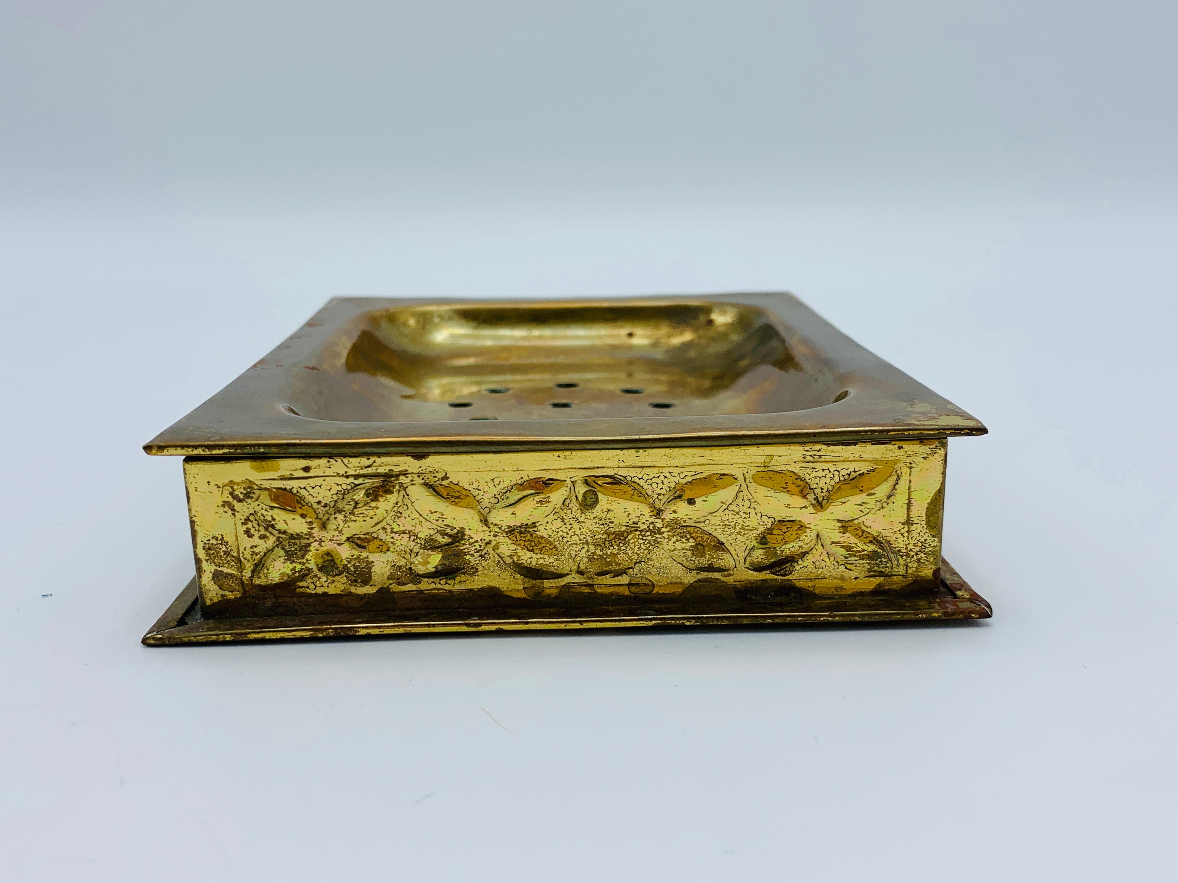 Listed is a gorgeous, 1970s Sarreid style brass hand-soap dish for a vanity or counter top. Top removes from base for cleaning. Lovely all-over patina, expected with age, see photos for reference. This piece definitely has a boho gone Hollywood