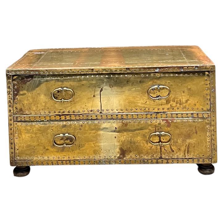 AMBIANIC presents
1970s Sarreid Ltd Brass Chest of Drawers
Glamorous chest or cocktail table 
sarried brass with nail head trim.
18.5 h 19.5 d x 34.25 w
Preowned vintage condition
Refer to images
Delivery to LA PS OC