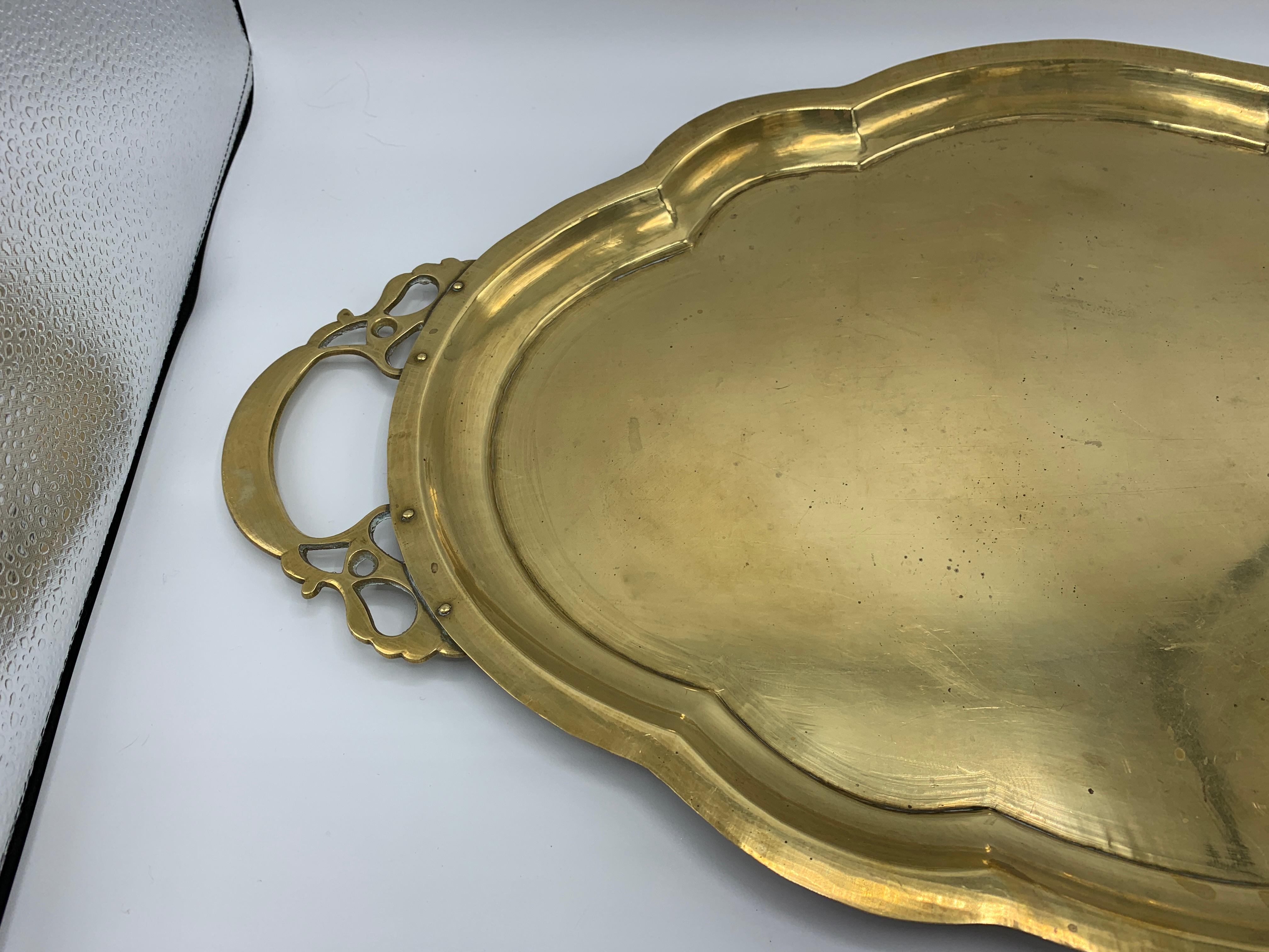 Offered is a gorgeous, 1970s brass tray with scalloped edging. Truly, a fabulous piece with its simple and elegant design. Heavy, weighing 3lbs.