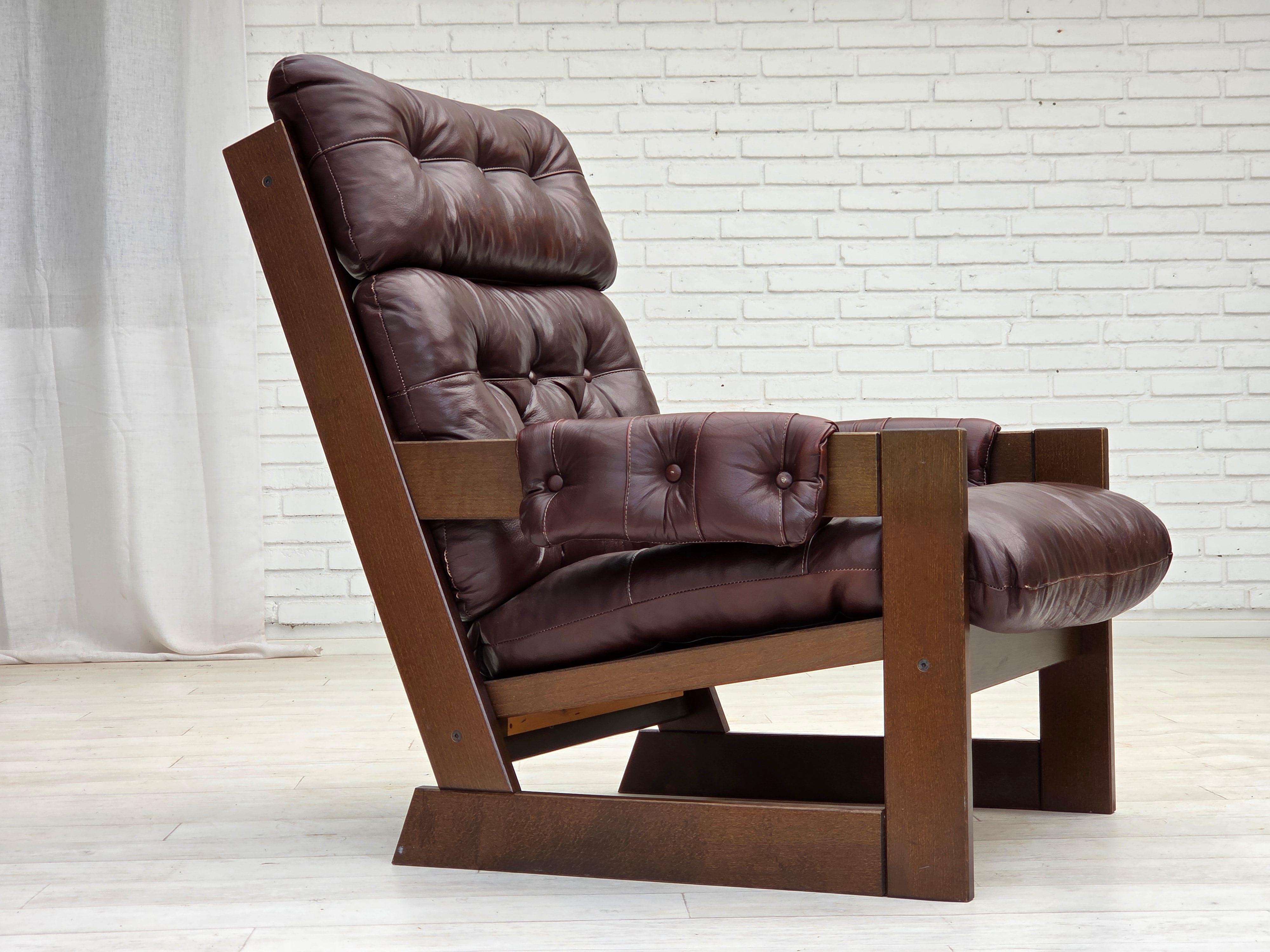 1970s, Scandinavian highback armchair. Brown furniture leather, dark beech wood. Original very good condition: no smells, no stains and stable construction. Manufactured by Danish or Swedish furniture maker in about 1975s. Original Scandinavian