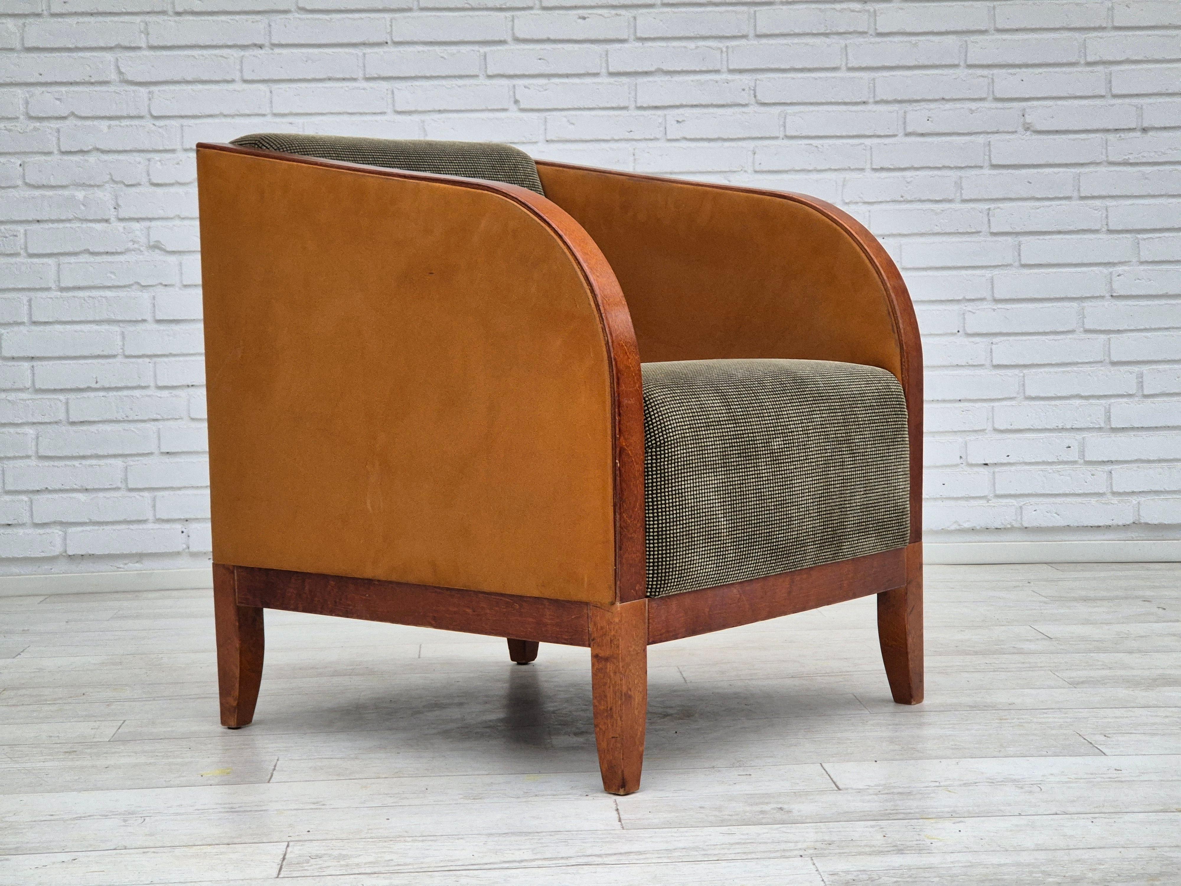 1970s, Scandinavian lounge chair in original very good condition: no smells and no stains. Art deco style from Sweden. Nubuck leather and bent wood on the armrests. Furniture fabric on the seat, ash wood legs and back. Manufactured by Swedish