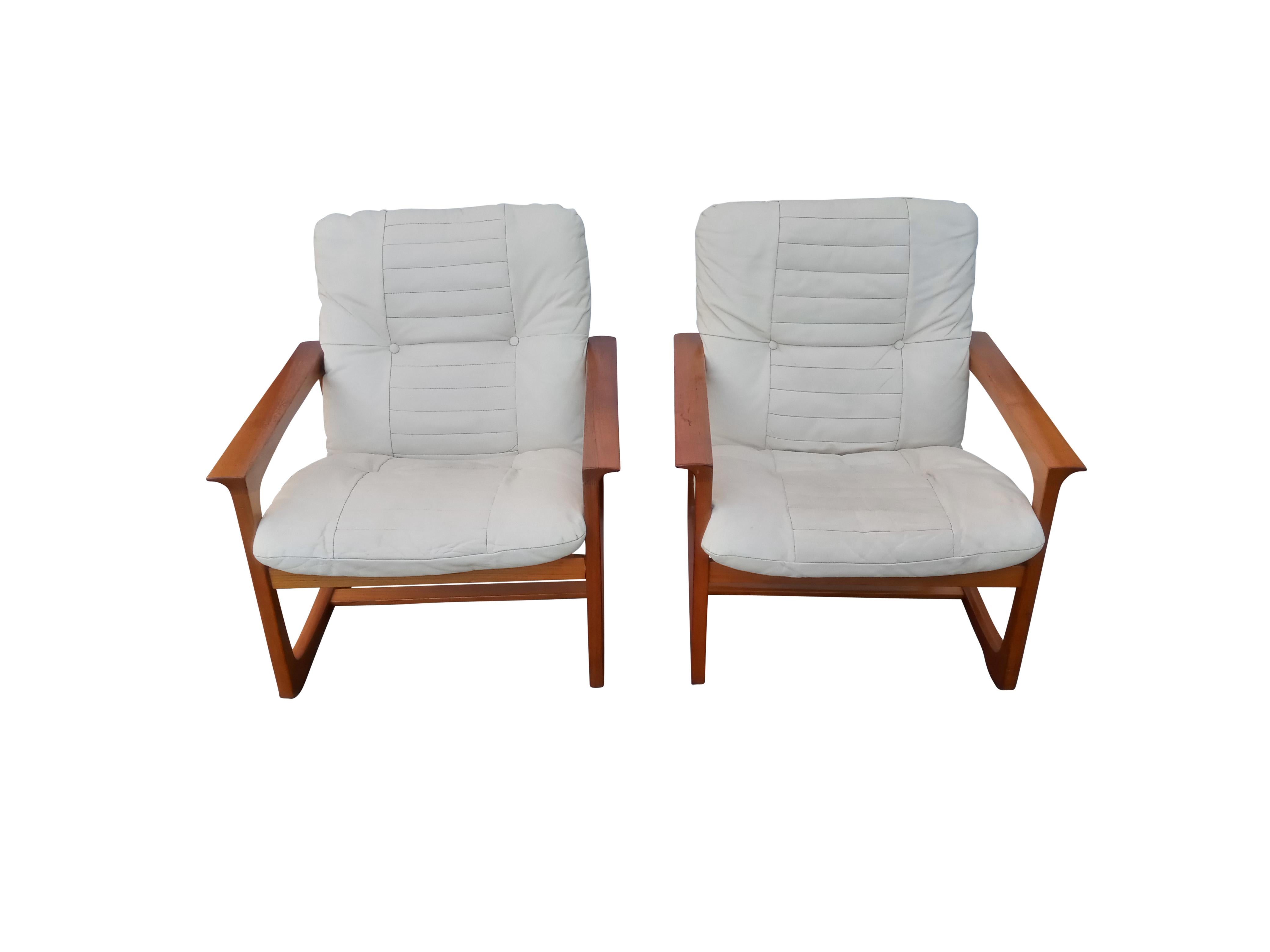 This pair of attractive teak and tailored leather cushions lounge chairs are as comfortable as they are good-looking. Made in Norway in the 1970s by Lied Mobler, the production quality of these chairs is very high. There is a rich, warm patina to
