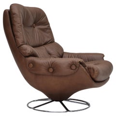 Vintage 1970s, Scandinavian swivel chair, original condition, brown furniture leather.