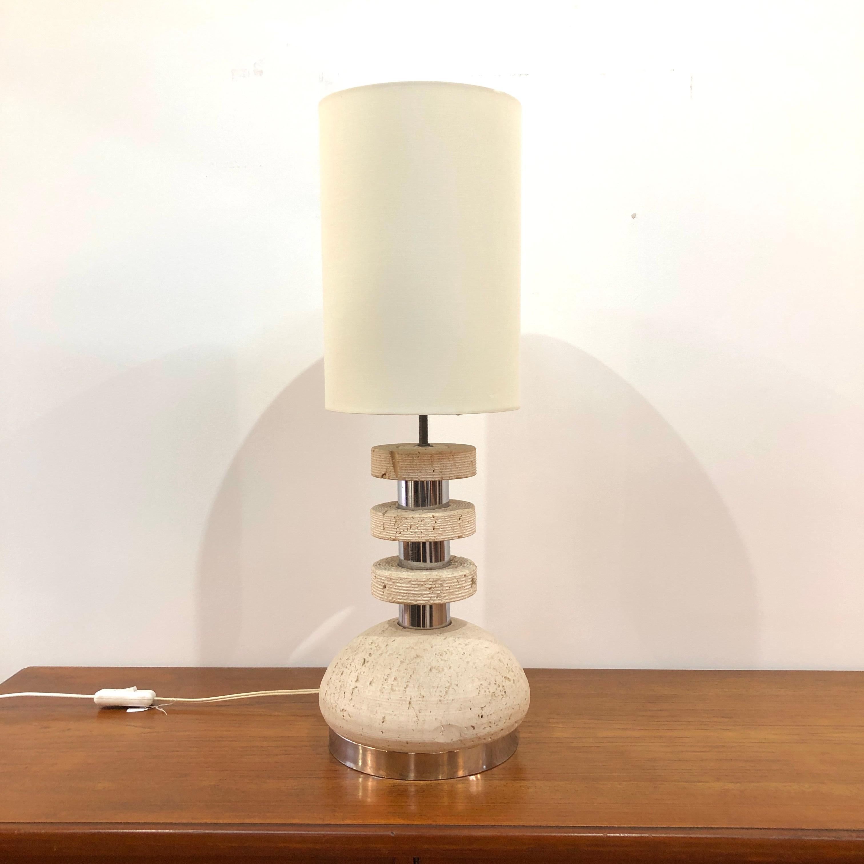 Travertine and Chrome lamp attributed to Italian sculpter Emanuele Scarnicci. A very pleasing contrast of materials with a freshly made shade. 

Please feel free to contact us for more information/photos.
