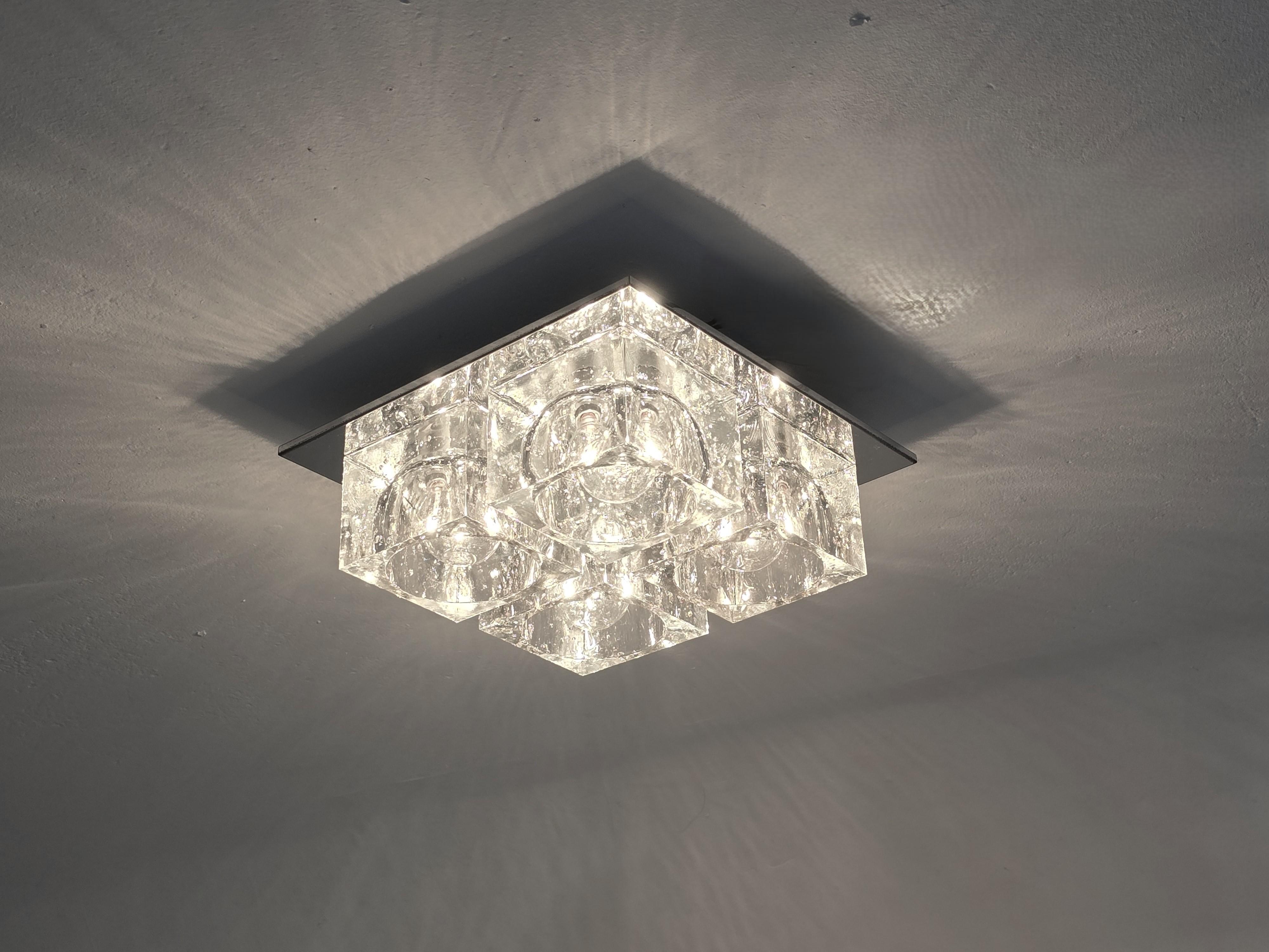 Classic thick , heavy , bubbly  glass cubes sitting on a chrome plate flush mount from Gaetano Sciolari . 

Each glass cube measure 4.25 in wide  3.18 in high . 

Require 4  candelabra E12 size round light bulb rated at 40 watt . 


