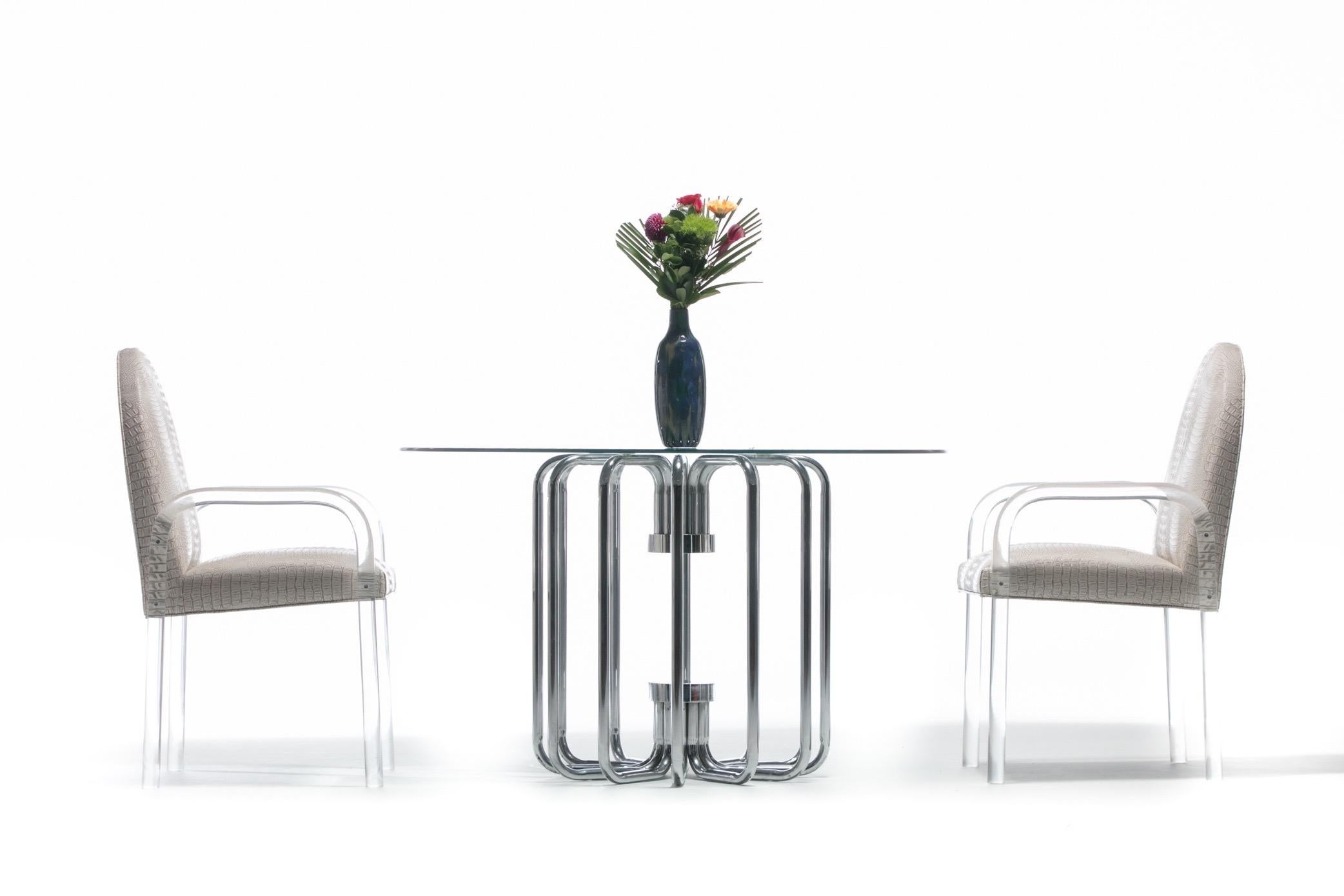 Modern sleek and sculptural chrome 1970s tubular dining or center table. This table is simply stunning. The photographs really capture its beauty. Curved chrome supports reflect and add a sense of lightness and air. A perfect choice for use as a