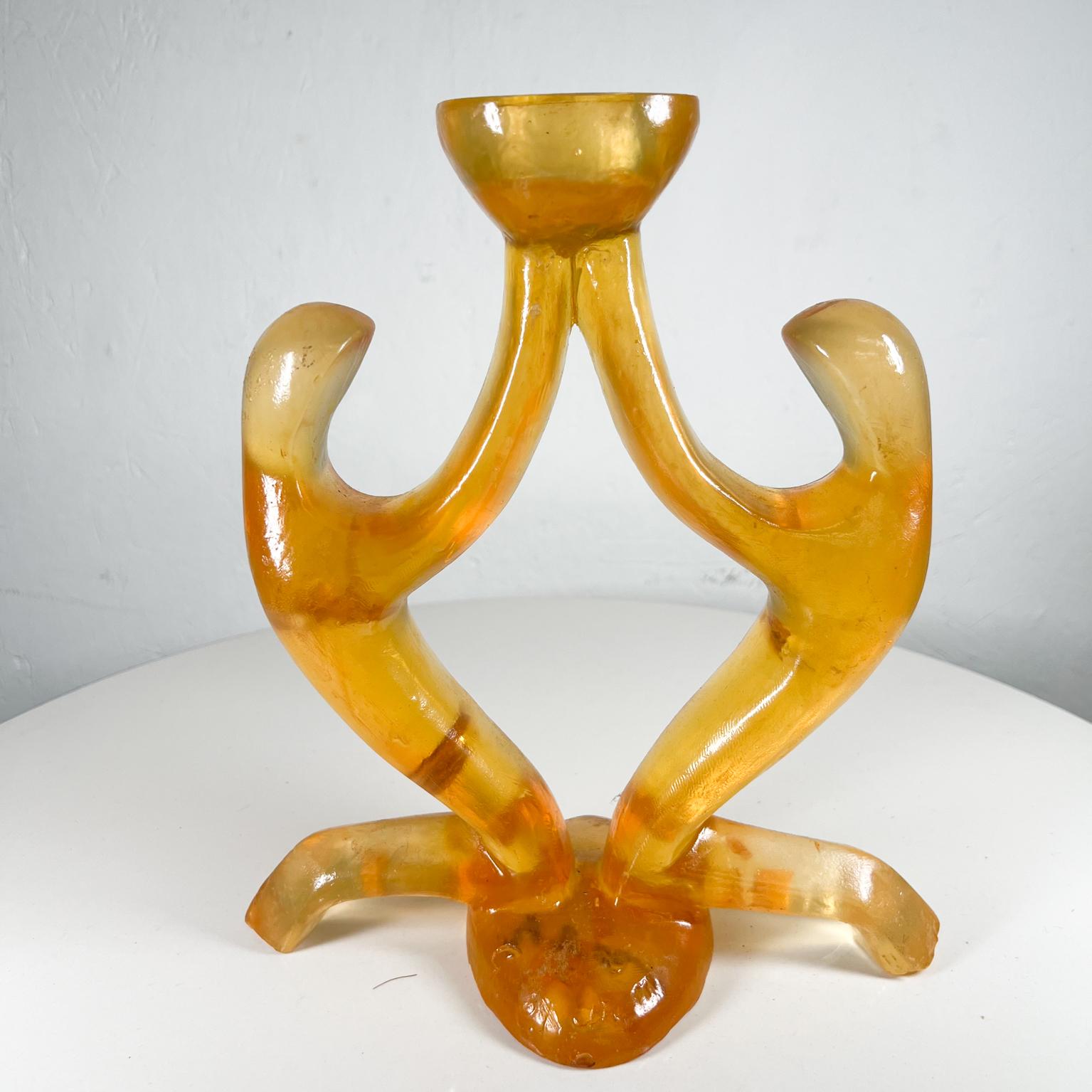 Vintage amber candle holder with sculptural shape.
Will hold one candle.
9.25 x 4.88 d x 10.63 tall
Signed at base. Unable read signature.
Original vintage preowned condition.
Refer to images.