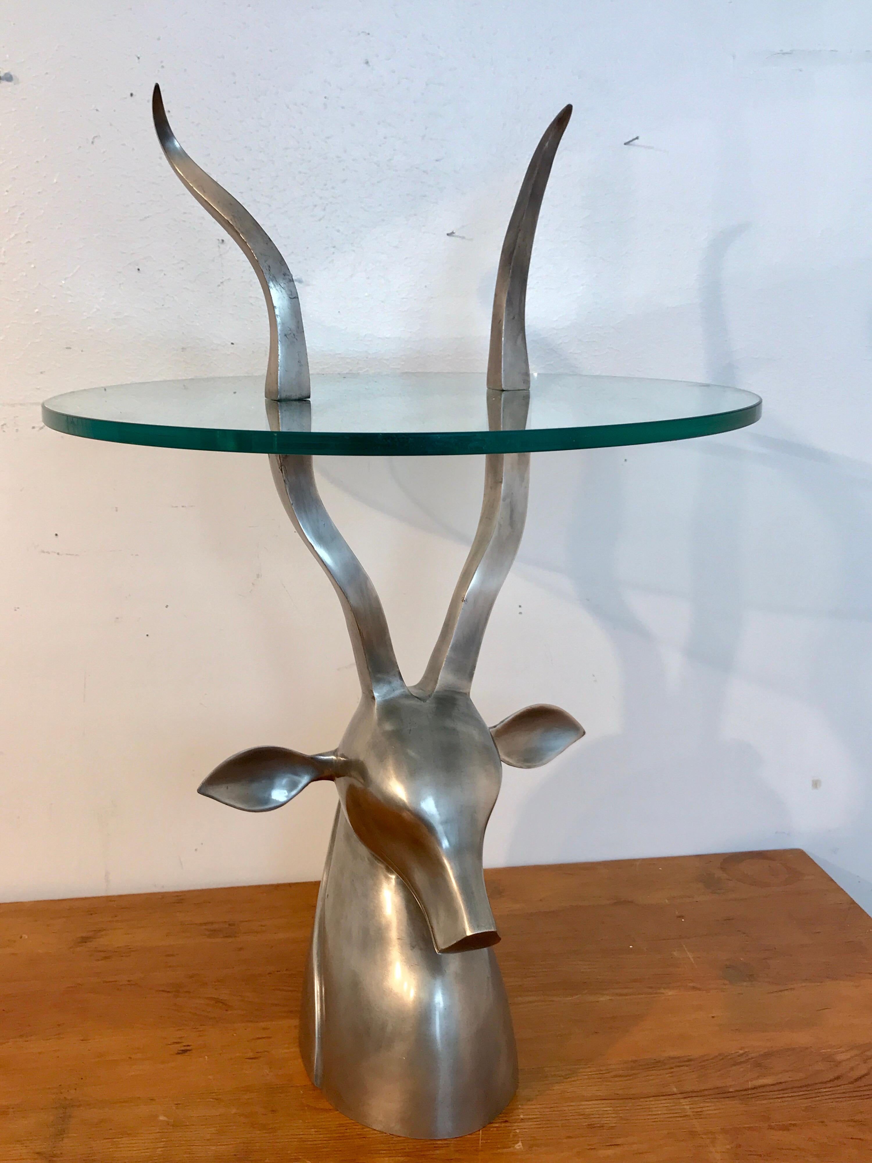 1970s sculptural Ibex drinks table, attributed to Arthur Court, with protruding horns through the 20 inch circular glass top. The total height to the tips of the horns is 30.5