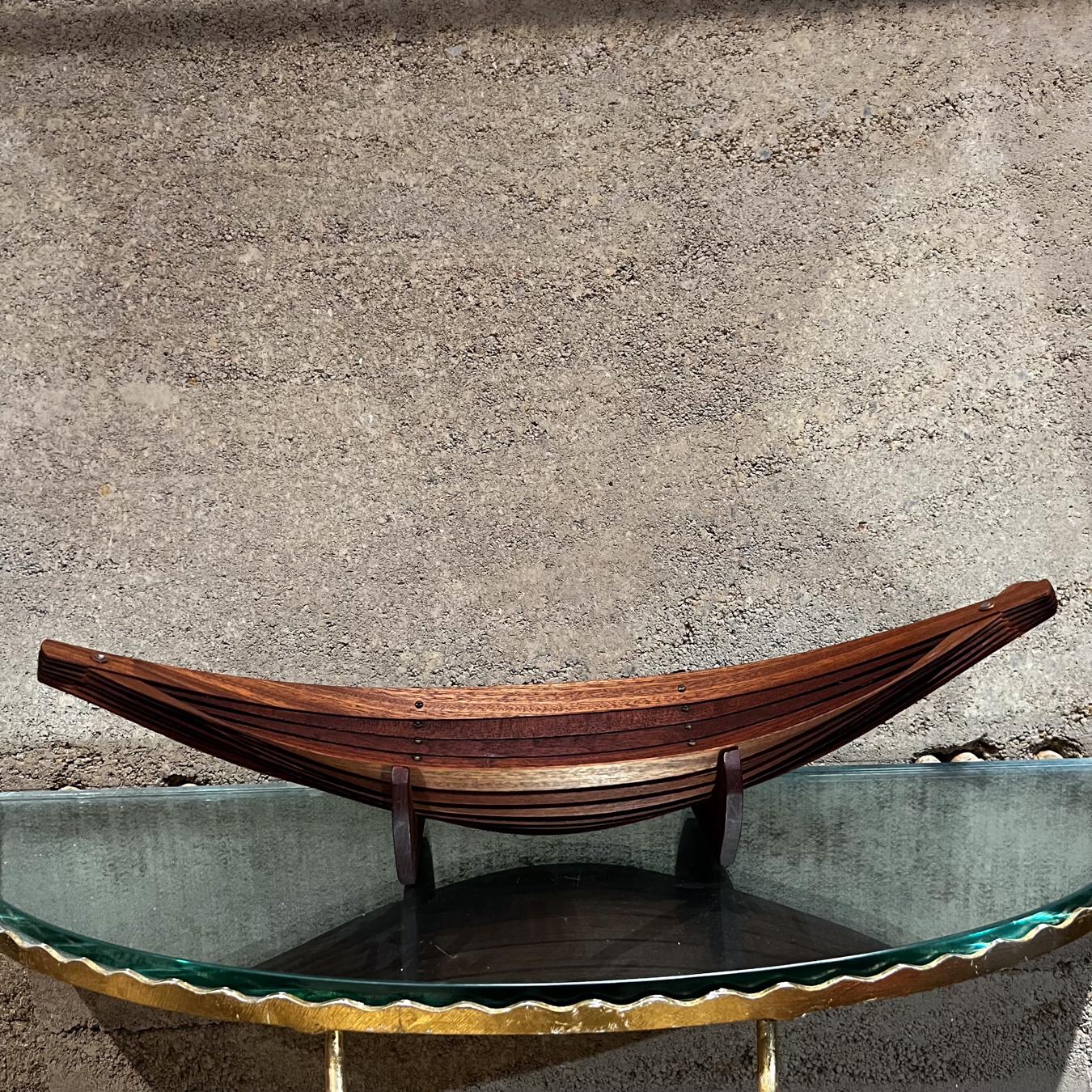 1970s Modern Sculptural Mahogany Brass Wood Canoe Bowl
5.25 h at tallest, 2.75 h at shortest x 21.5 wide x 6 depth
Preowned vintage condition
See images provided.