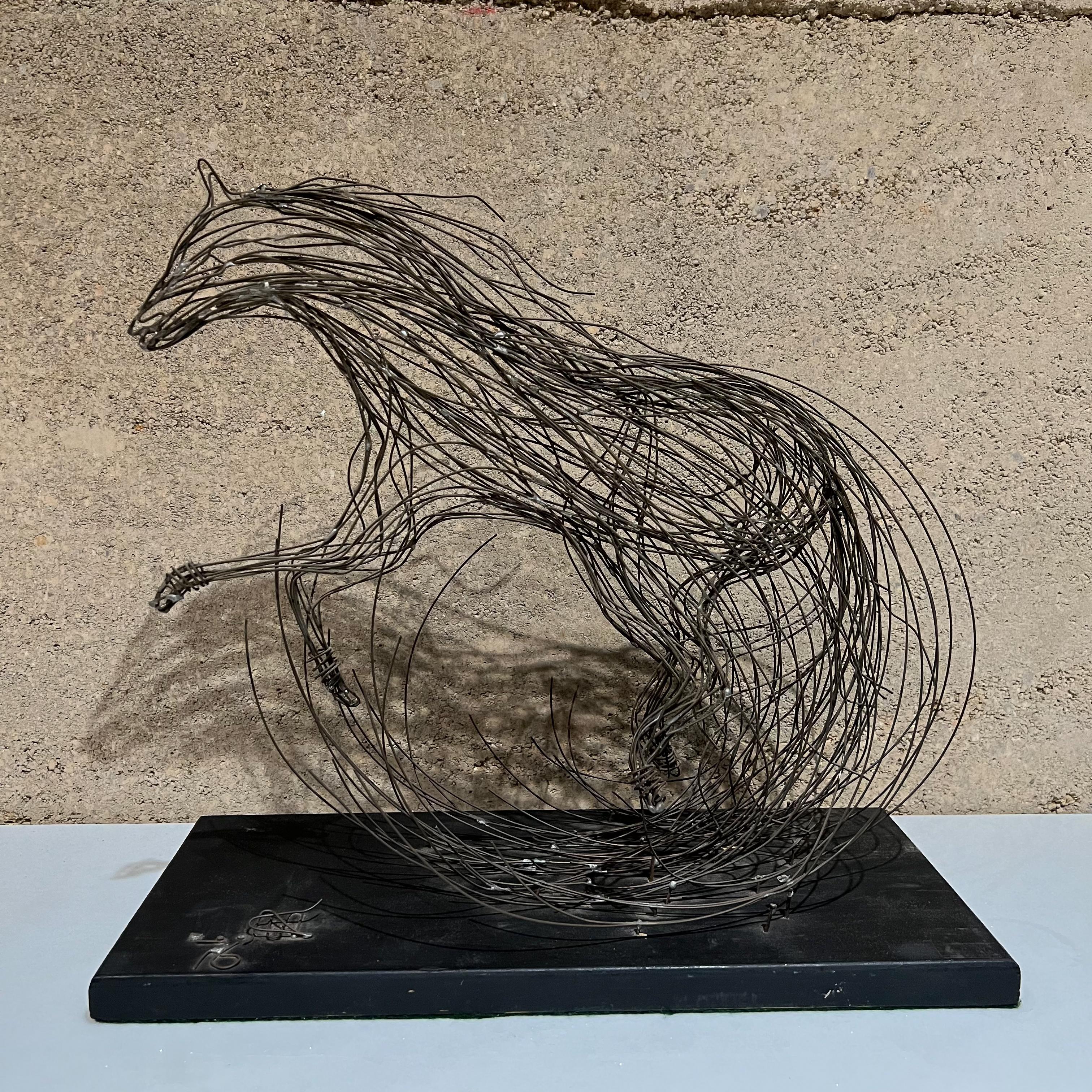 1970s Sculptural Modernism Horse Table Sculpture Brutalist Metal Wire Art
Artist's signature in wire nailed to wood base. Part of signature is missing. 
Unable to read.
14.5 tall x 15.25 w x 7 d
Preowned unrestored vintage condition.
See images