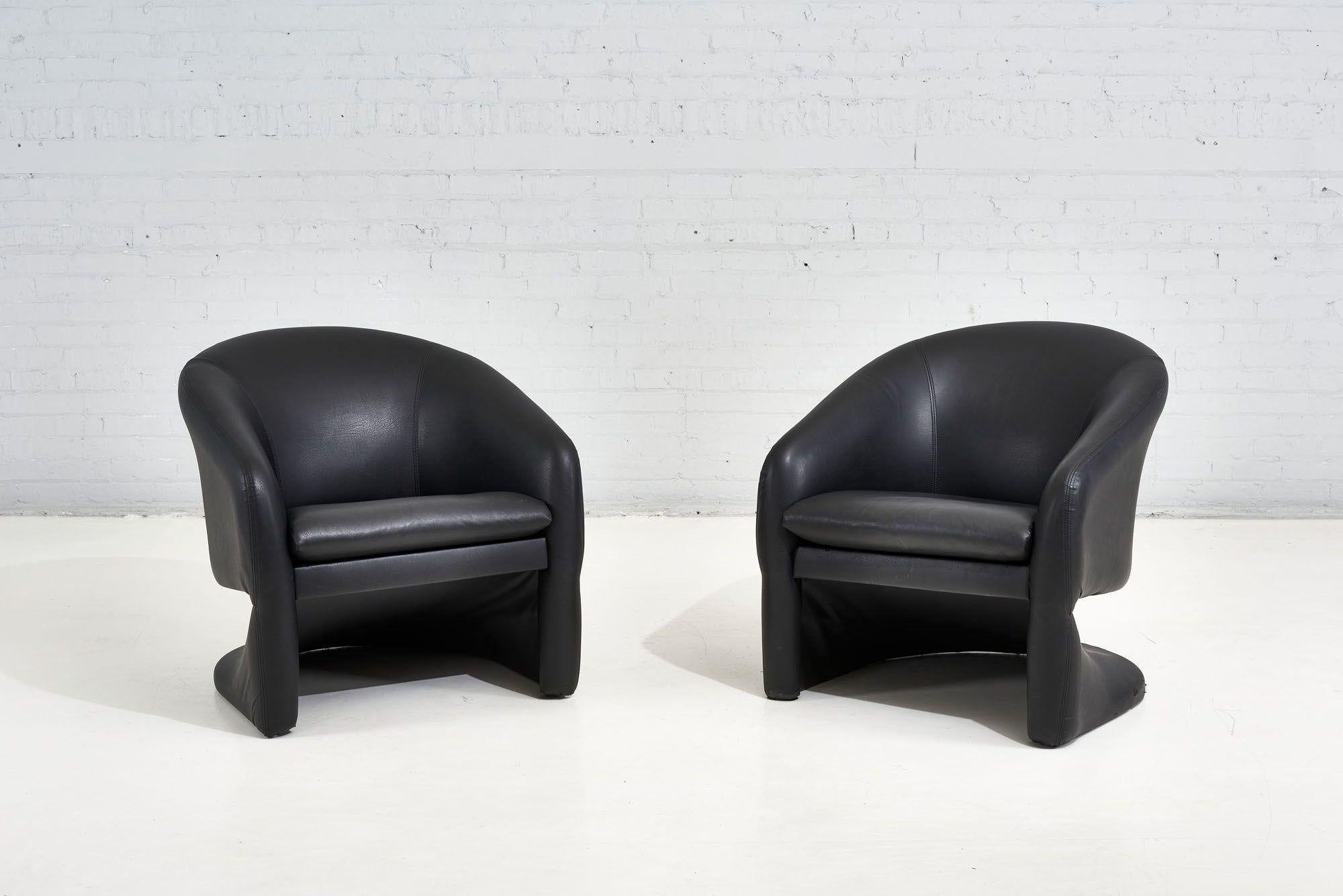 1970's Sculptural Postmodern Lounge Chairs. Original black vinyl upholstery and in very good condition.