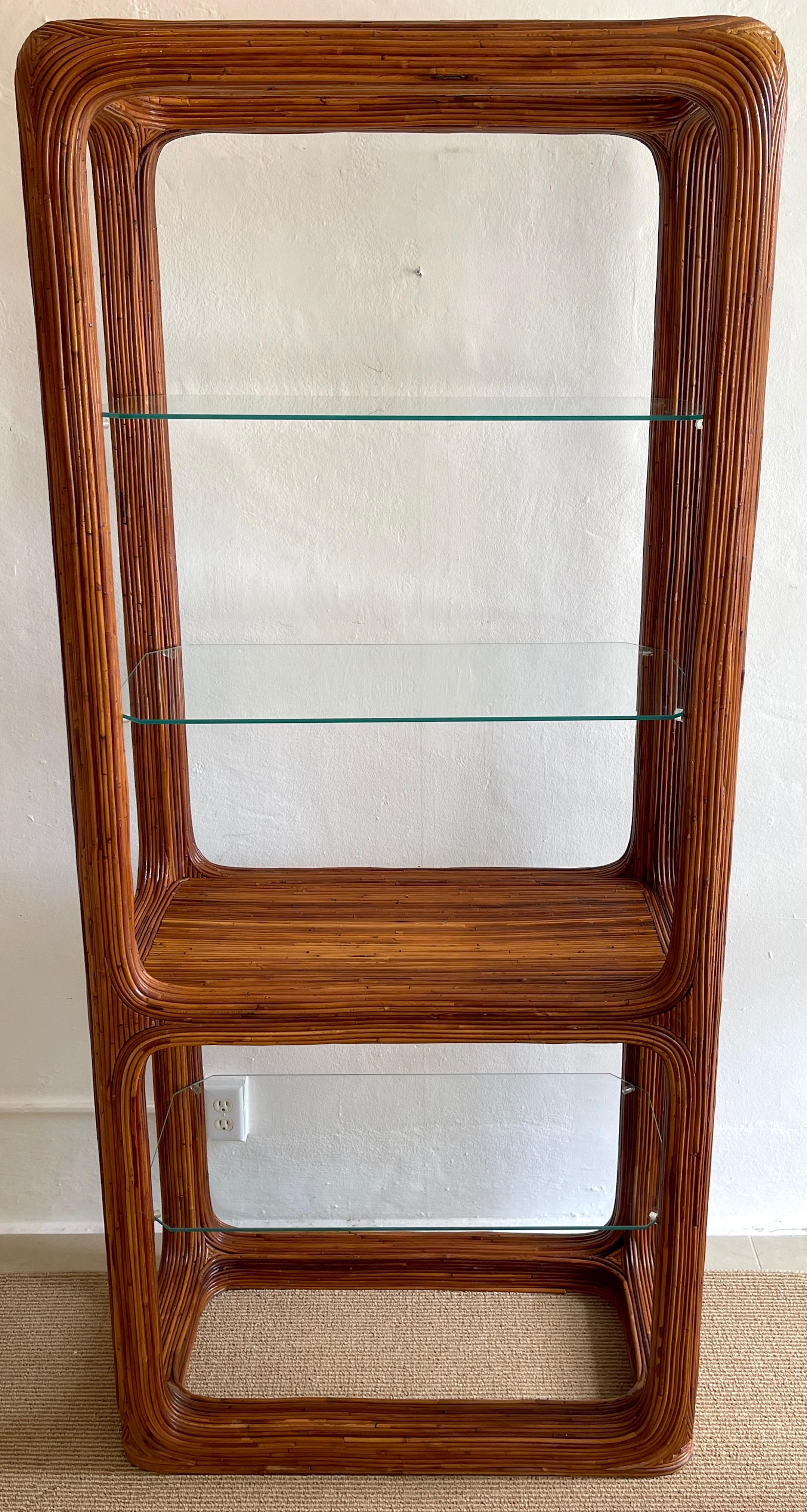 1970s sculptural rattan & glass etagere
The case with continuous book-matched rattan 
The upper section measures 24.5