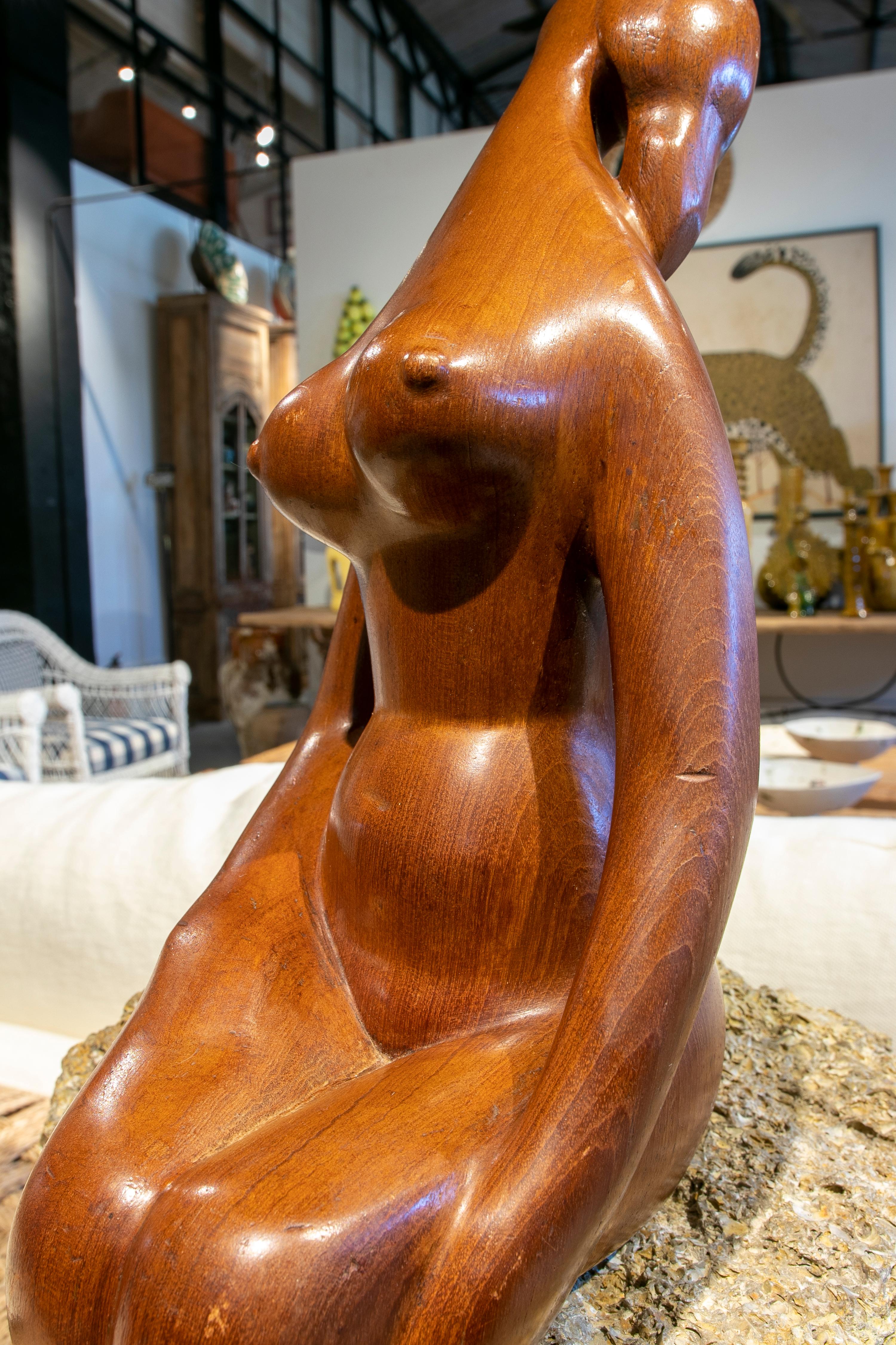 1970s Sculpture of a Seated Woman Carved in Wood on an Oyster Stone Base For Sale 4