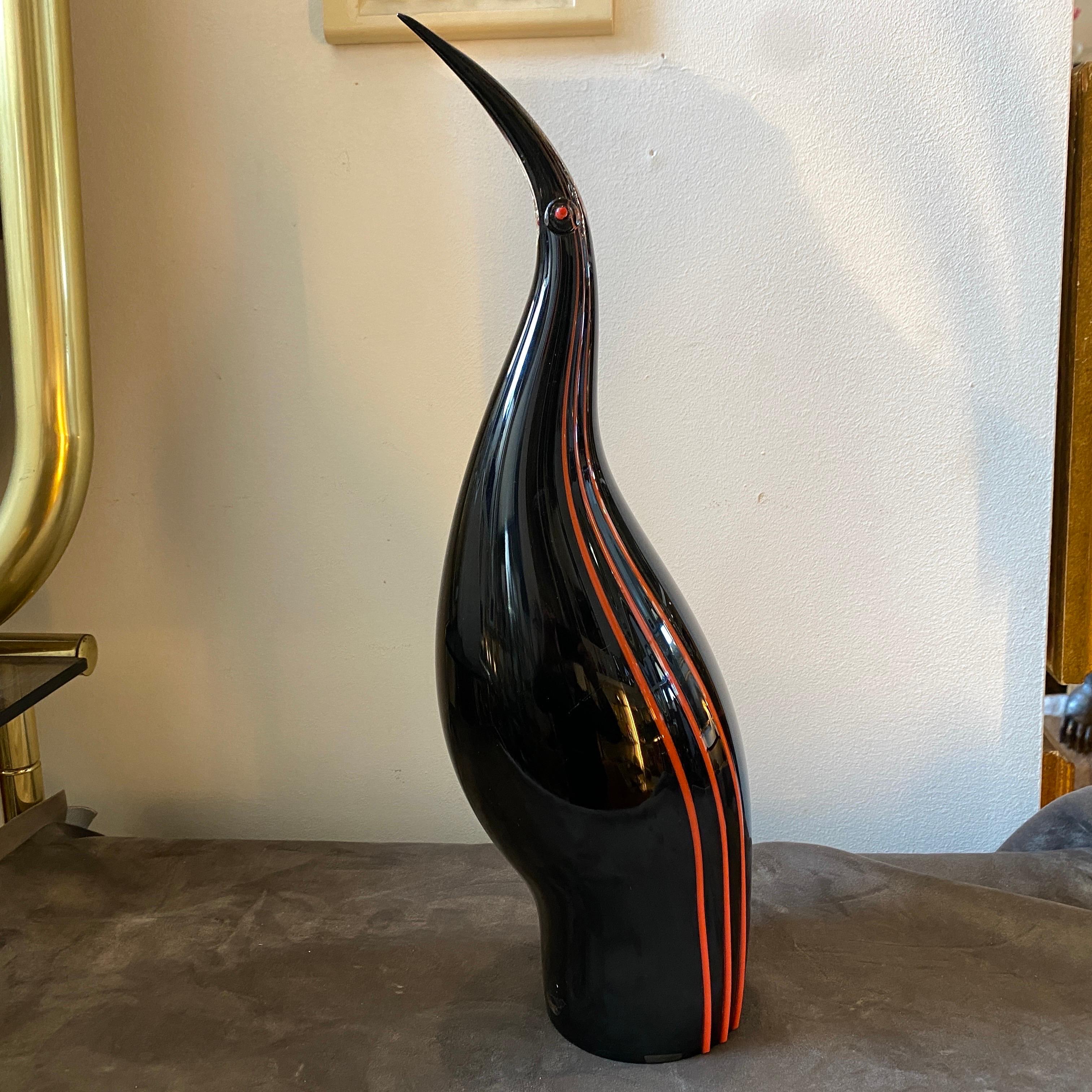 An amazing modernist sculpture of a Penguin designed and manufactured in Venice by Seguso. the red and black murano glass it's in perfect conditions, its acid signed on the bottom and labeled on a side. This Murano Glass Penguin is a striking piece
