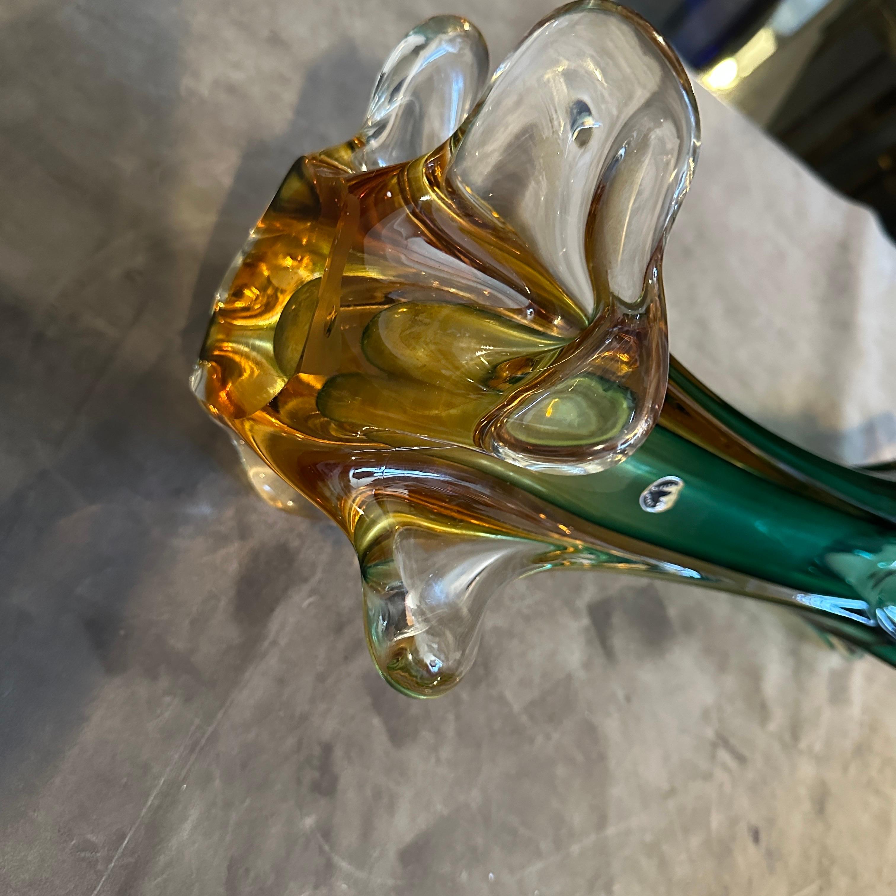 Exquisite 1970s Green and Yellow Sommerso Murano Glass Sculptural Vase.
Immerse your space in the vibrant artistry of Murano with this stunning 1970s sculptural glass vase, masterfully crafted in the renowned Sommerso technique, strongly reminiscent