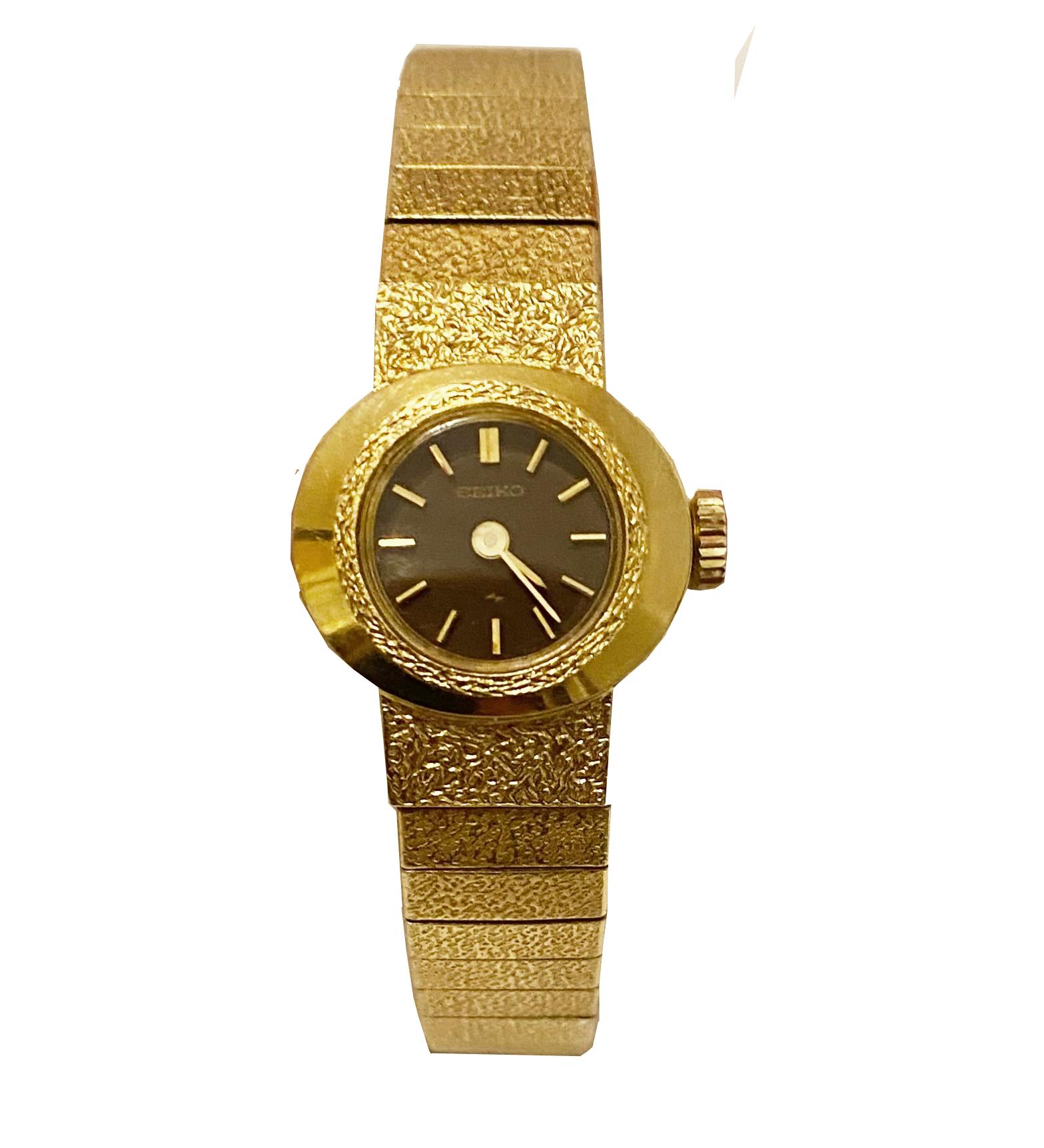 1970S Seiko Gold Tone Mesh Cocktail Wrist watch . It has a small 1cm round face in black with gold numerals, wind-up. 

Measurements: 
Face: 1cm 
Strap length: 17cm 

Condition: vintage, 1970s, very good, fully functioning, in the original box

