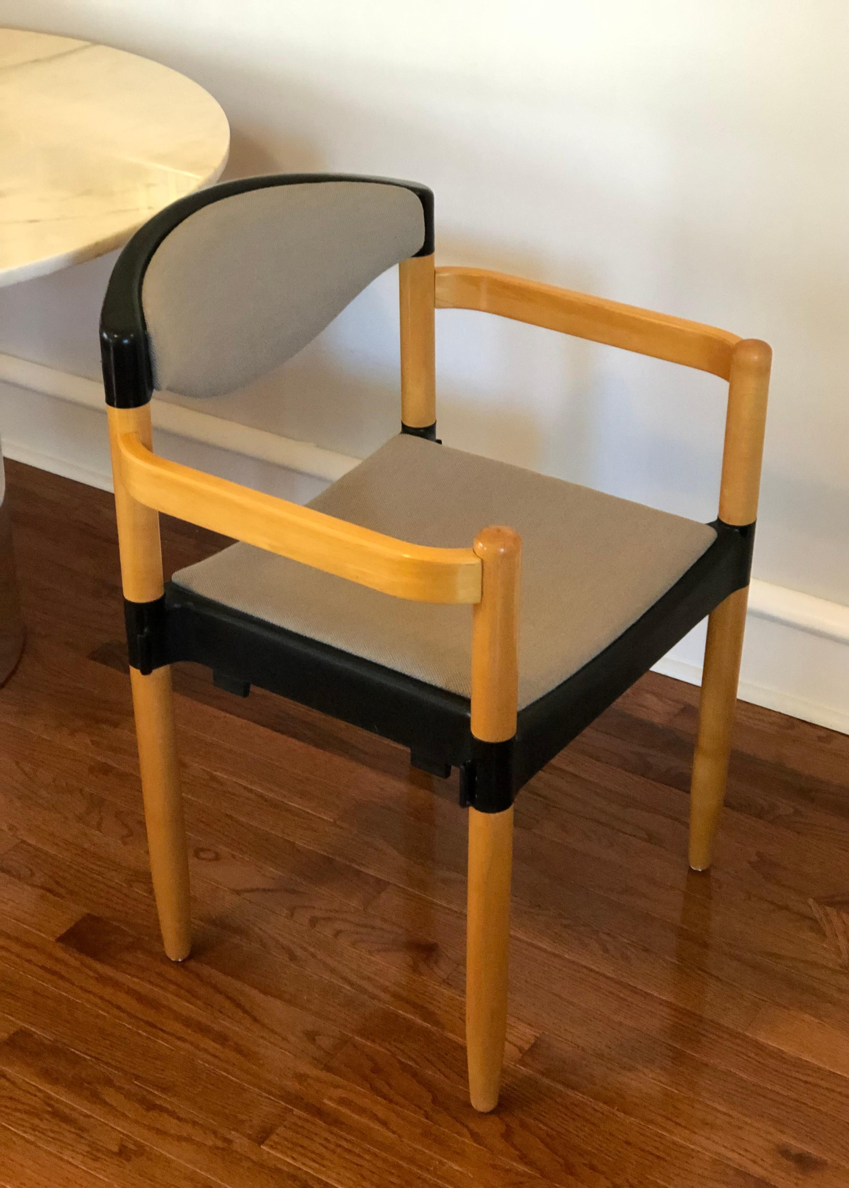 This is a set of 8 vintage “Strax” dining armchairs, designed by Hartmut Lohmeyer for Casala circa 1970’s.

This early post-modern design features great beech wood arms and legs, has a durable molded plastic backs and seats, and these examples have