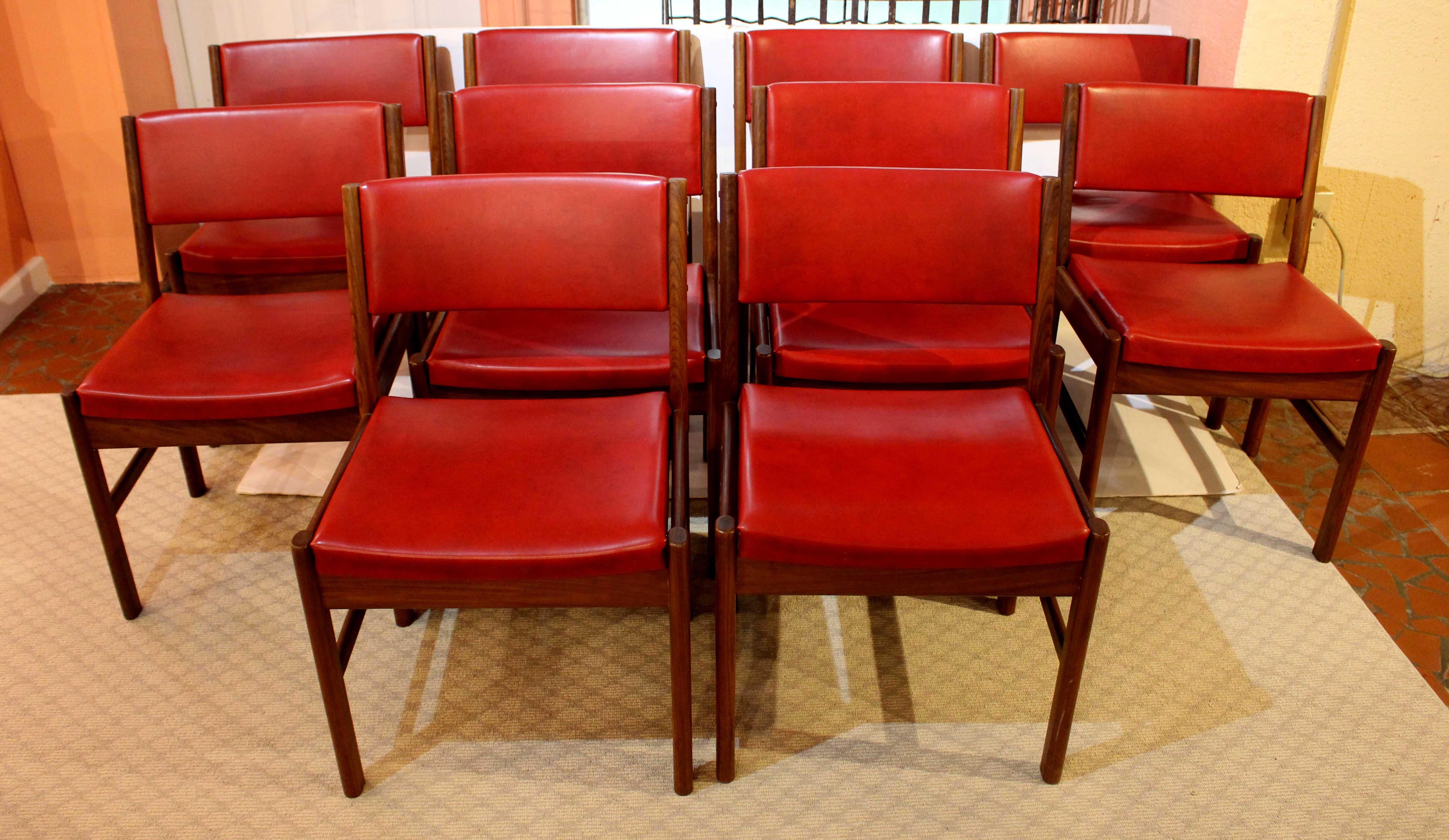 1970s set of 10 mid century modern side chairs, English. Teak with original red vinyl upholstered backs & seats. Stylishly molded legs, sides & backs. 19