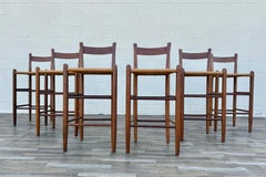 Set degli anni '70 composto da 6 sgabelli da bar in legno massello in stile moderno danese con sedute intrecciate in giunco
