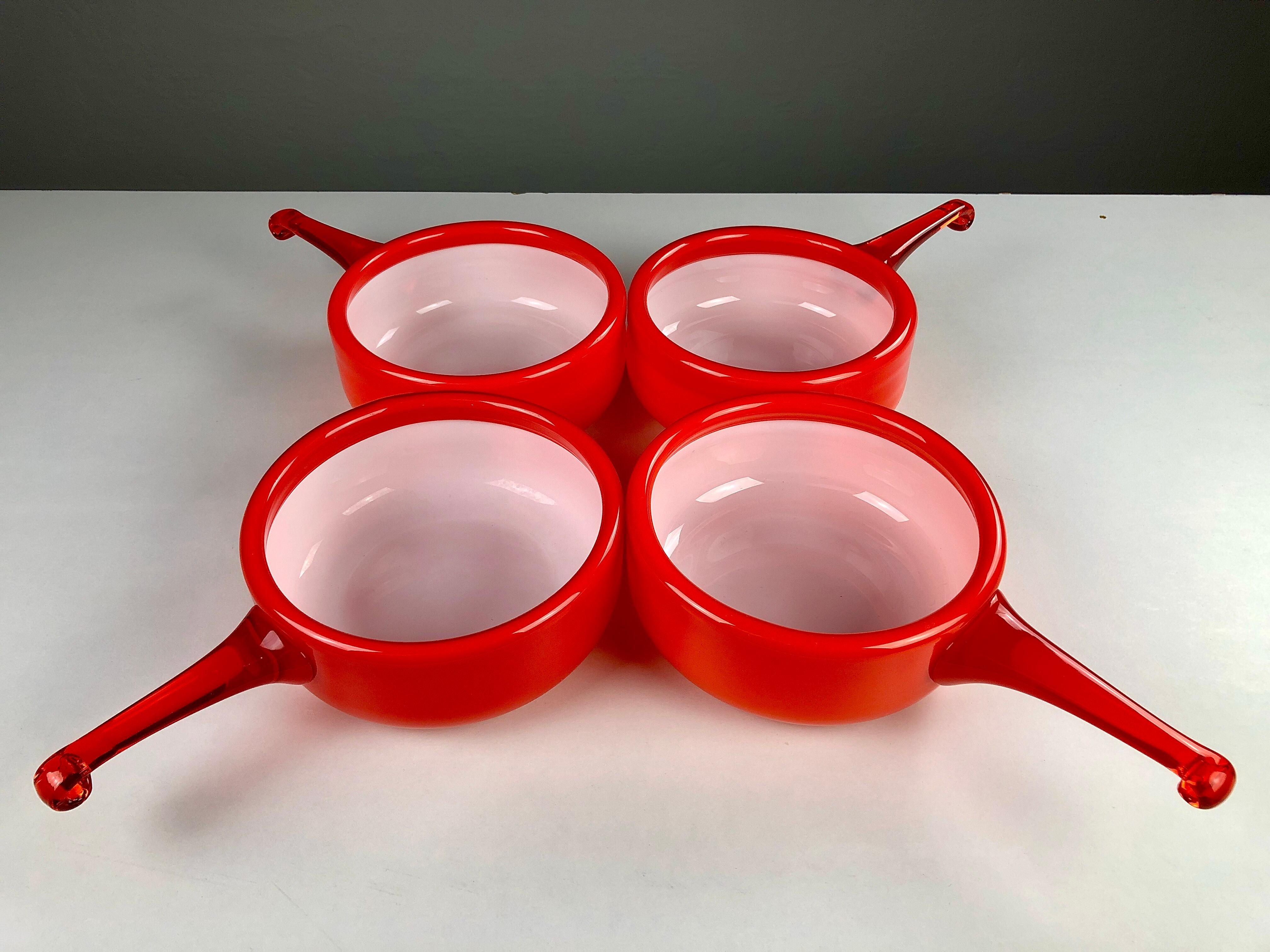 Set of Four Bowls in Handblown Opal Glass designed by Michael Bang and produced by Holmegaard in the 1970s.

The well designed set with it´s 1970´s colors is in very good condition and is due to the opal glass known for it´s easy to clean