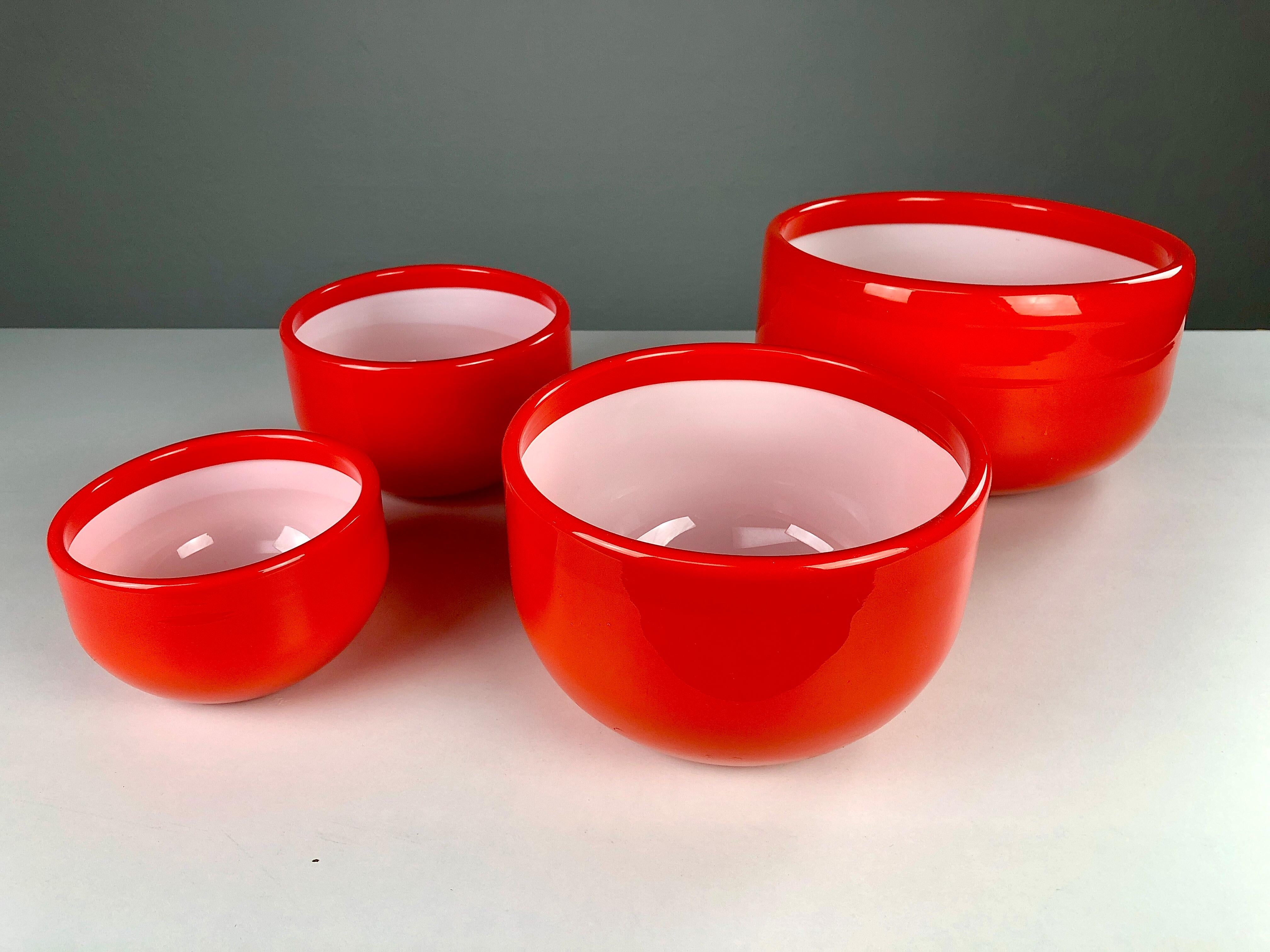 Set of four bowls in handblown opal glass designed by Michael Bang and produced by Holmegaard in the 1970s.

The well designed set with it´s 1970´s colors is in very good condition and is due to the opal glass known for it´s easy to clean abilities