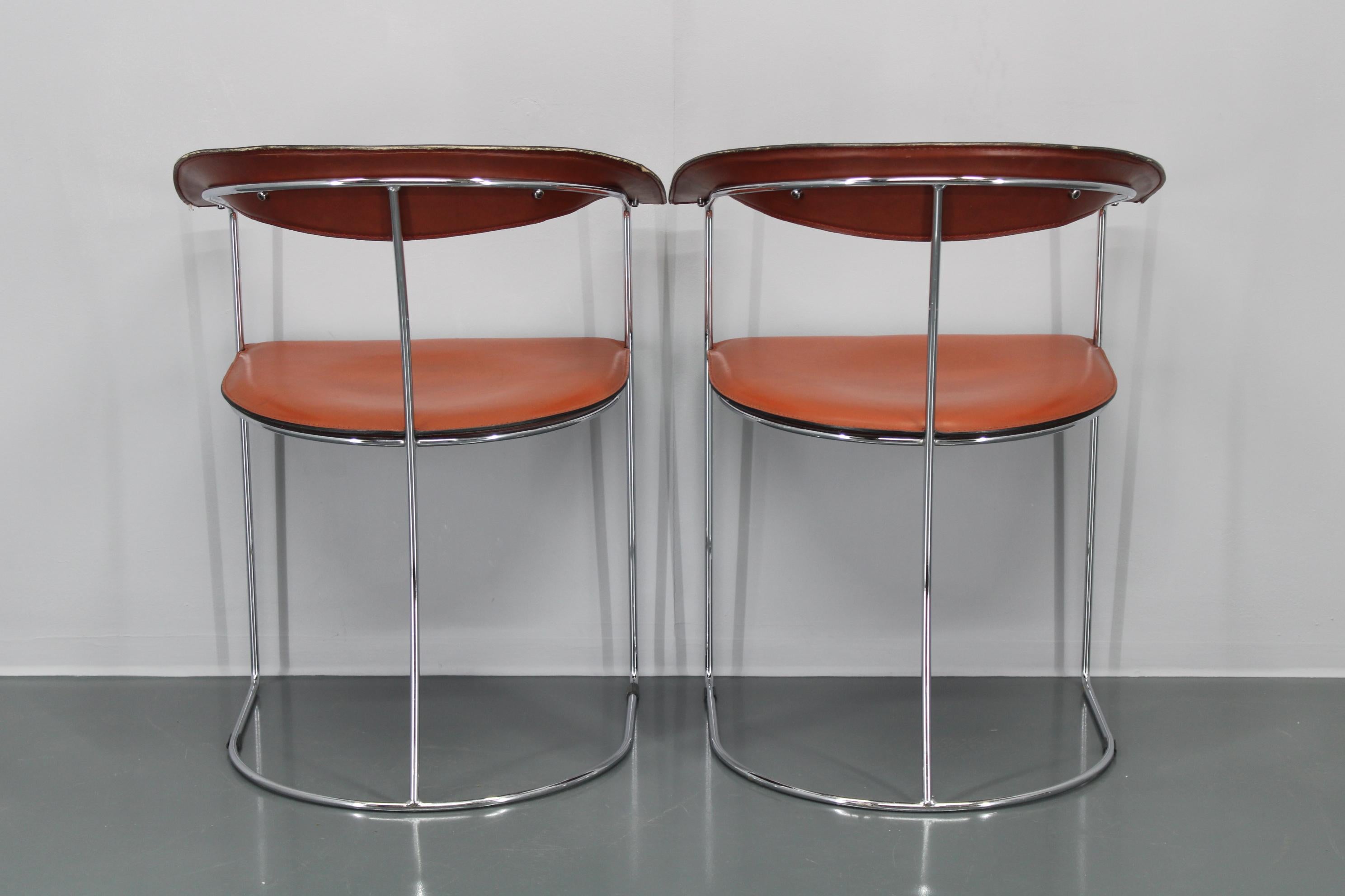 Set di quattro poltrone in pelle 