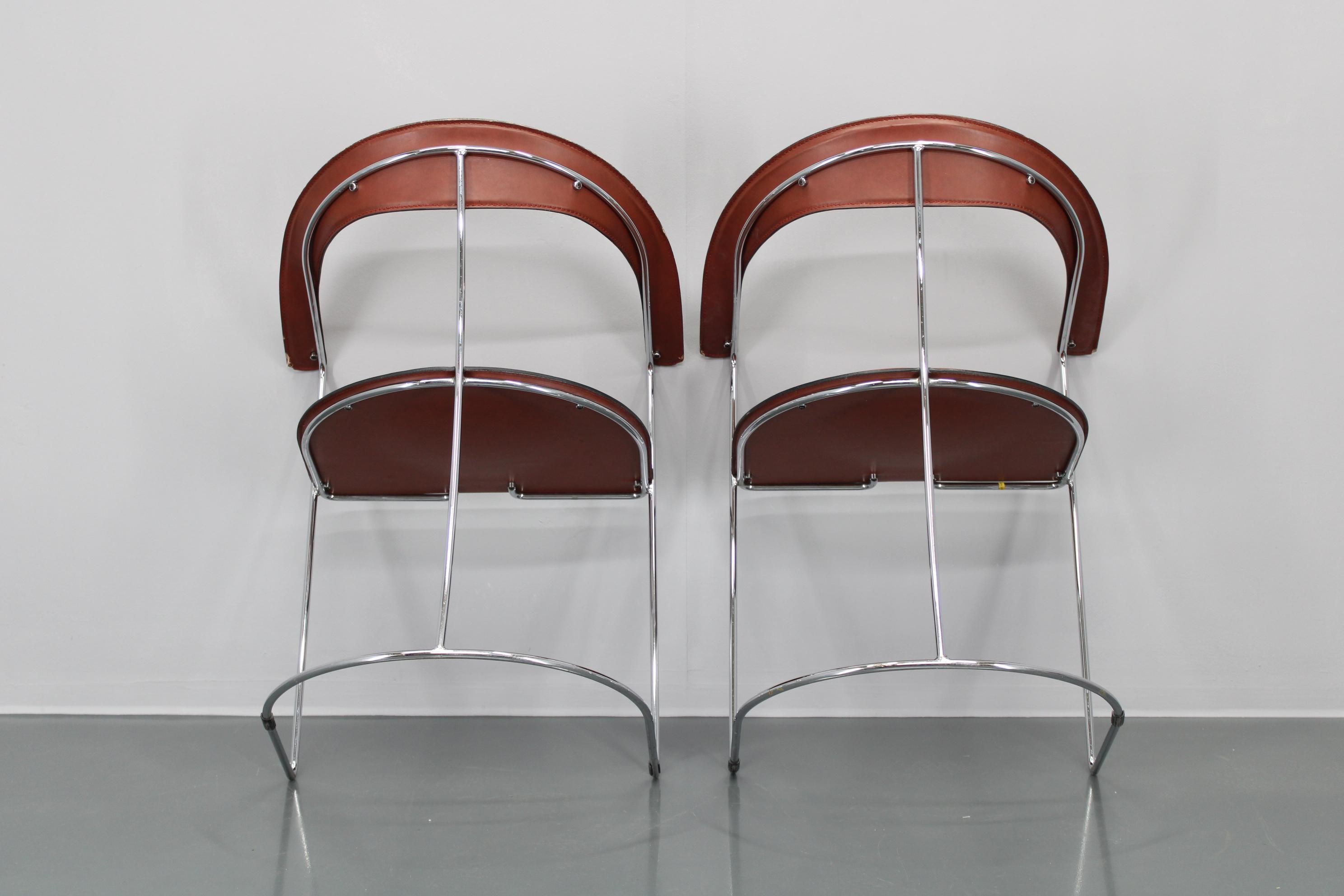 Set di quattro poltrone in pelle 