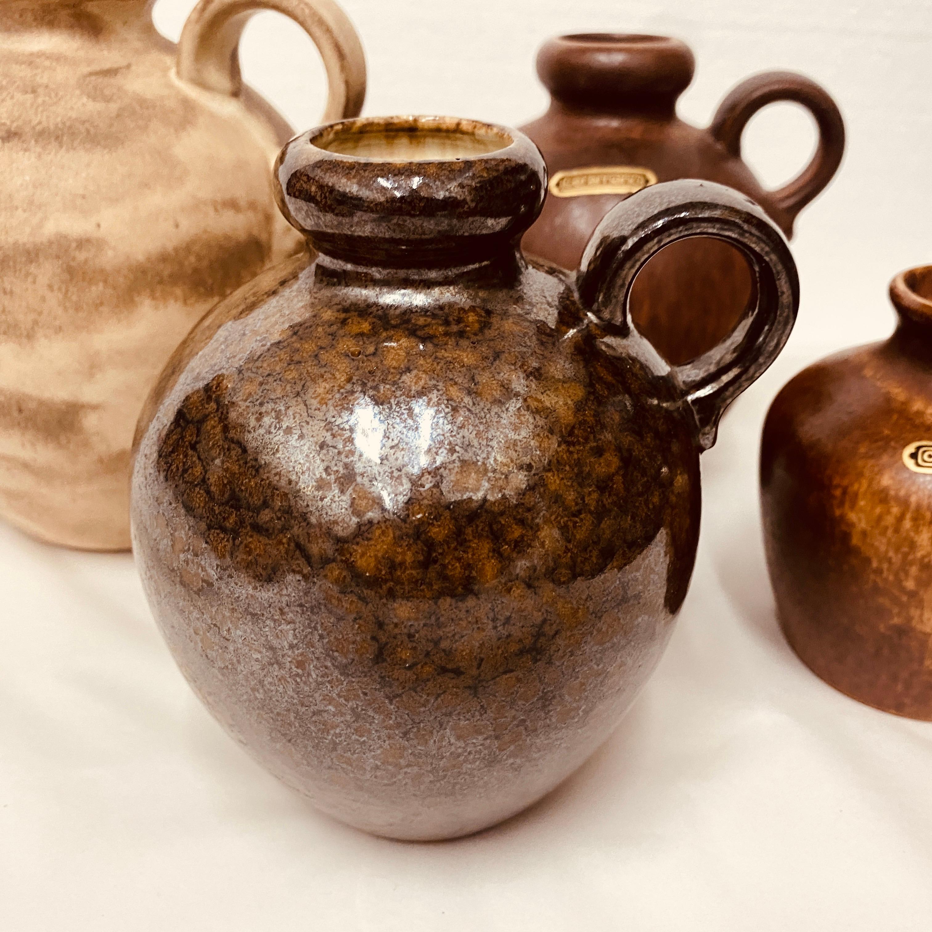 Four hand-crafted jugs made in Germany in the Seventies by Ceramano, they are in perfect conditions and labeled and signed on the bottom.