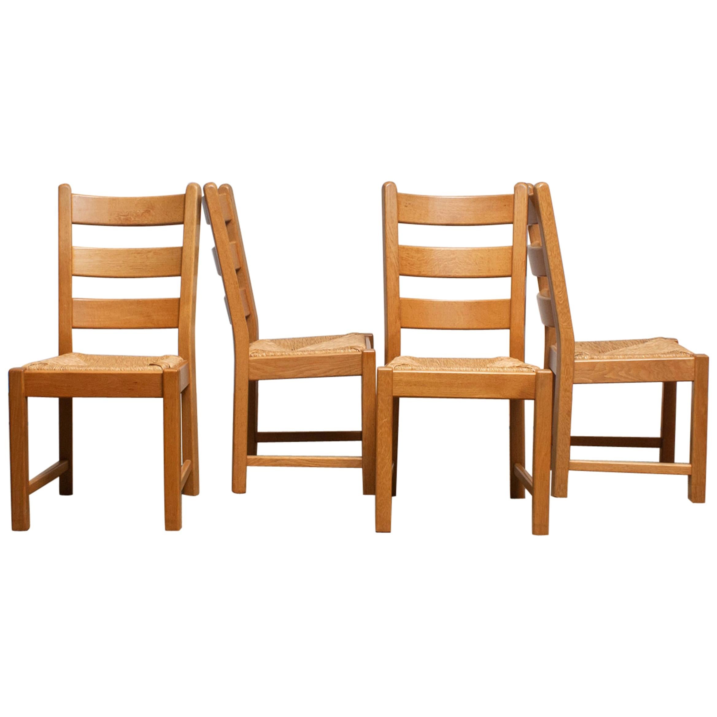 Beautiful set of four Dutch Bohemian dining chairs with wicker seats.
 All four in very good condition.
Period, end of the 1970s.