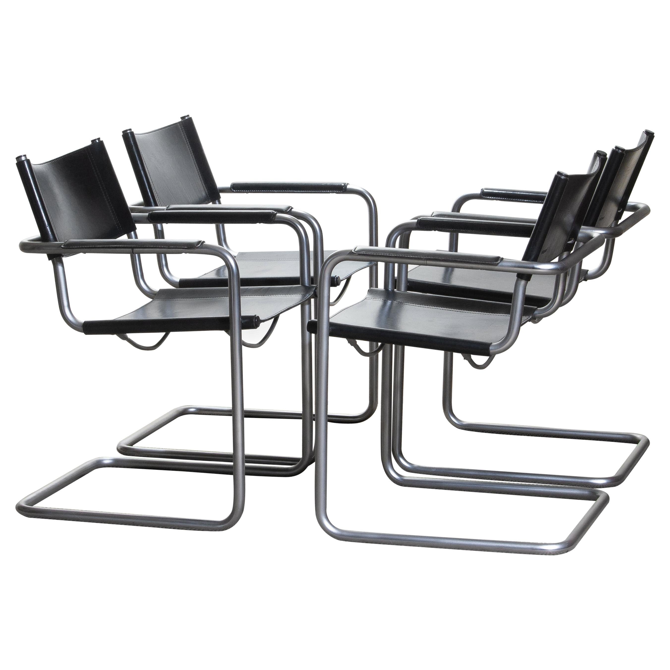 1970. Perfect set of four dining / office chairs made by Matteo Grassi, Italy.
The chairs have tubular titanium look steel frames with sturdy black leather seating and backrest.
They are signed on the back of the backrest.
Overall condition is