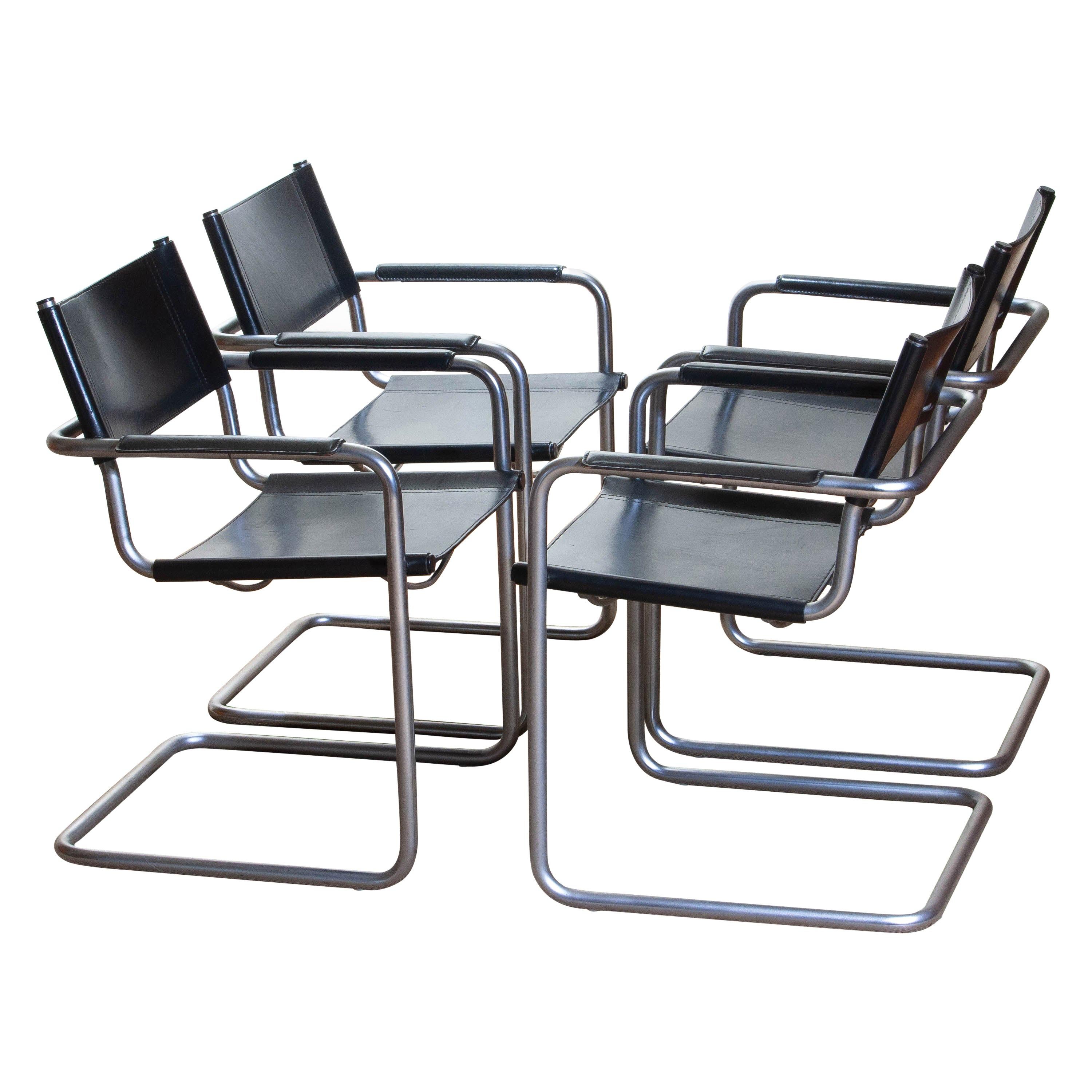 1970, perfect set of four dining / office chairs made by Matteo Grassi, Italy.
The chairs have tubular titanium look steel frames with sturdy black leather seating and backrest.
They are signed on the back of the backrest.
Overall condition is