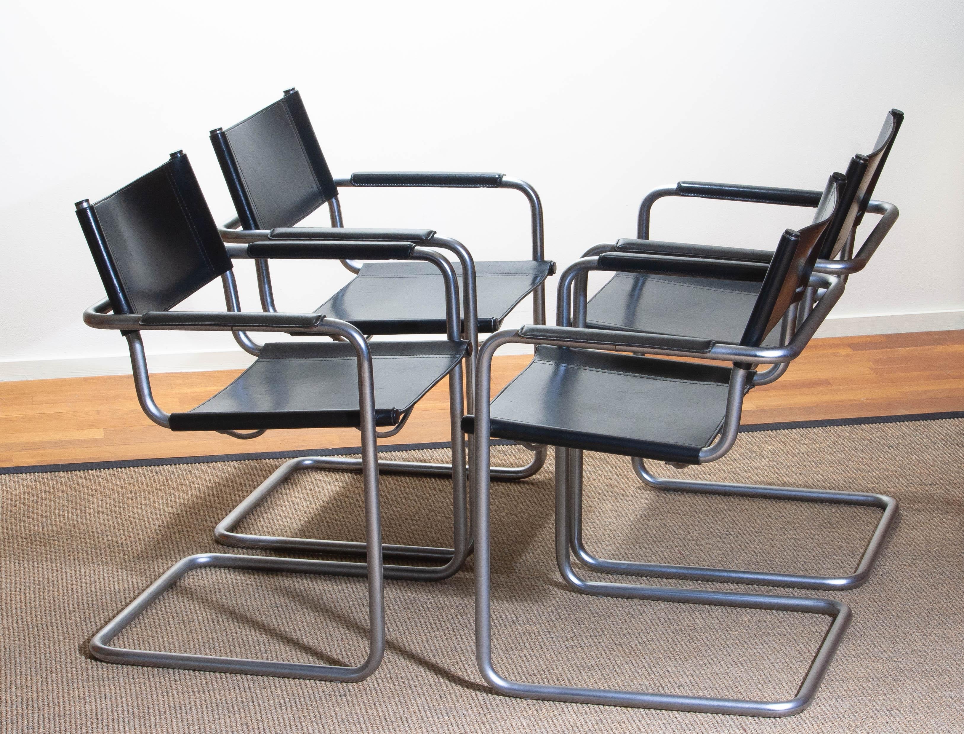 1970, perfect set of four dining or office chairs made by Matteo Grassi, Italy.
The chairs have tubular titanium look steel frames with sturdy black leather seating and backrest.
They are signed on the back of the backrest.
Overall condition is