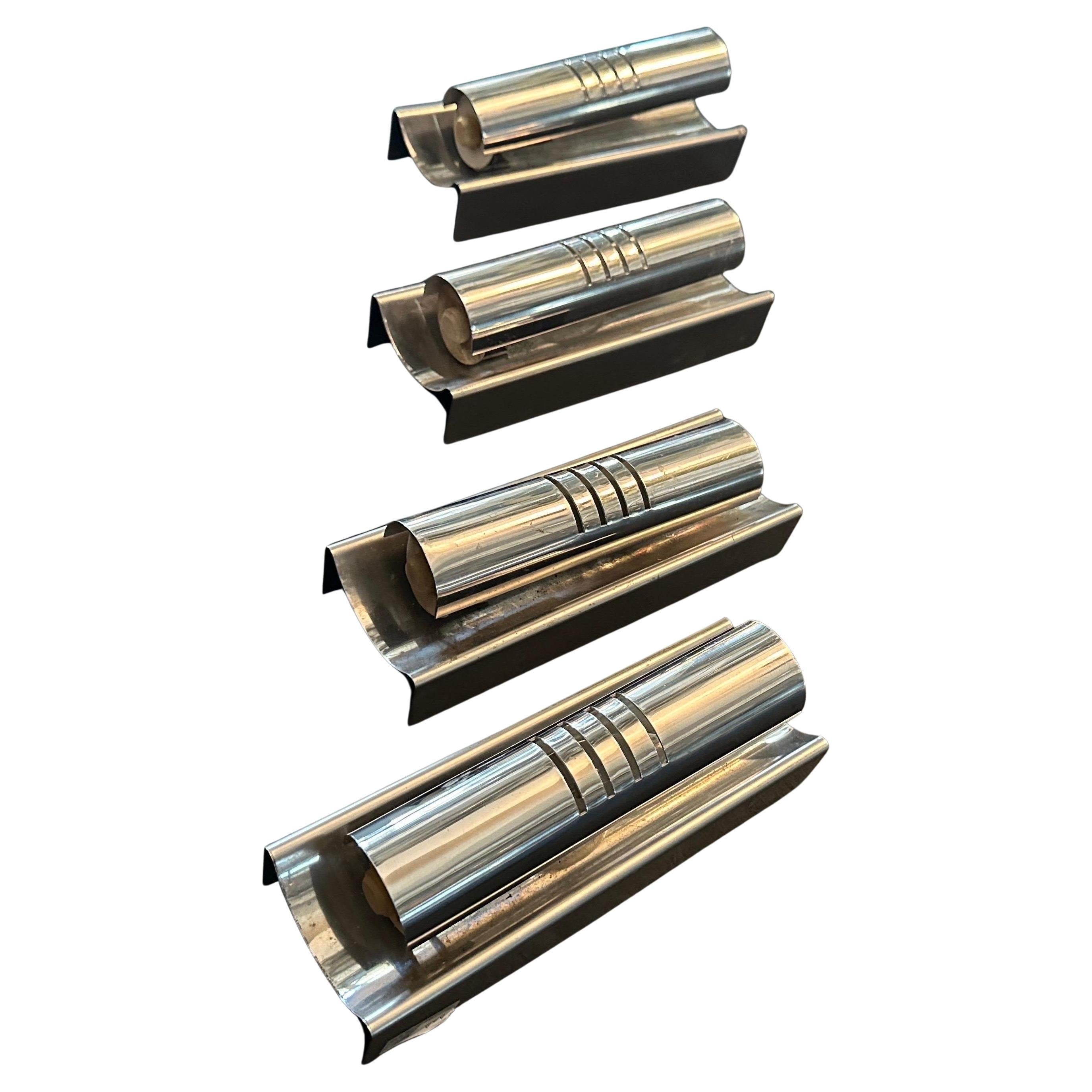 These sconces exemplify the Space Age design style, which was heavily influenced by advancements in science and technology during the mid-20th century, particularly the Space Race.
The sconces are crafted from polished steel, giving them a sleek,