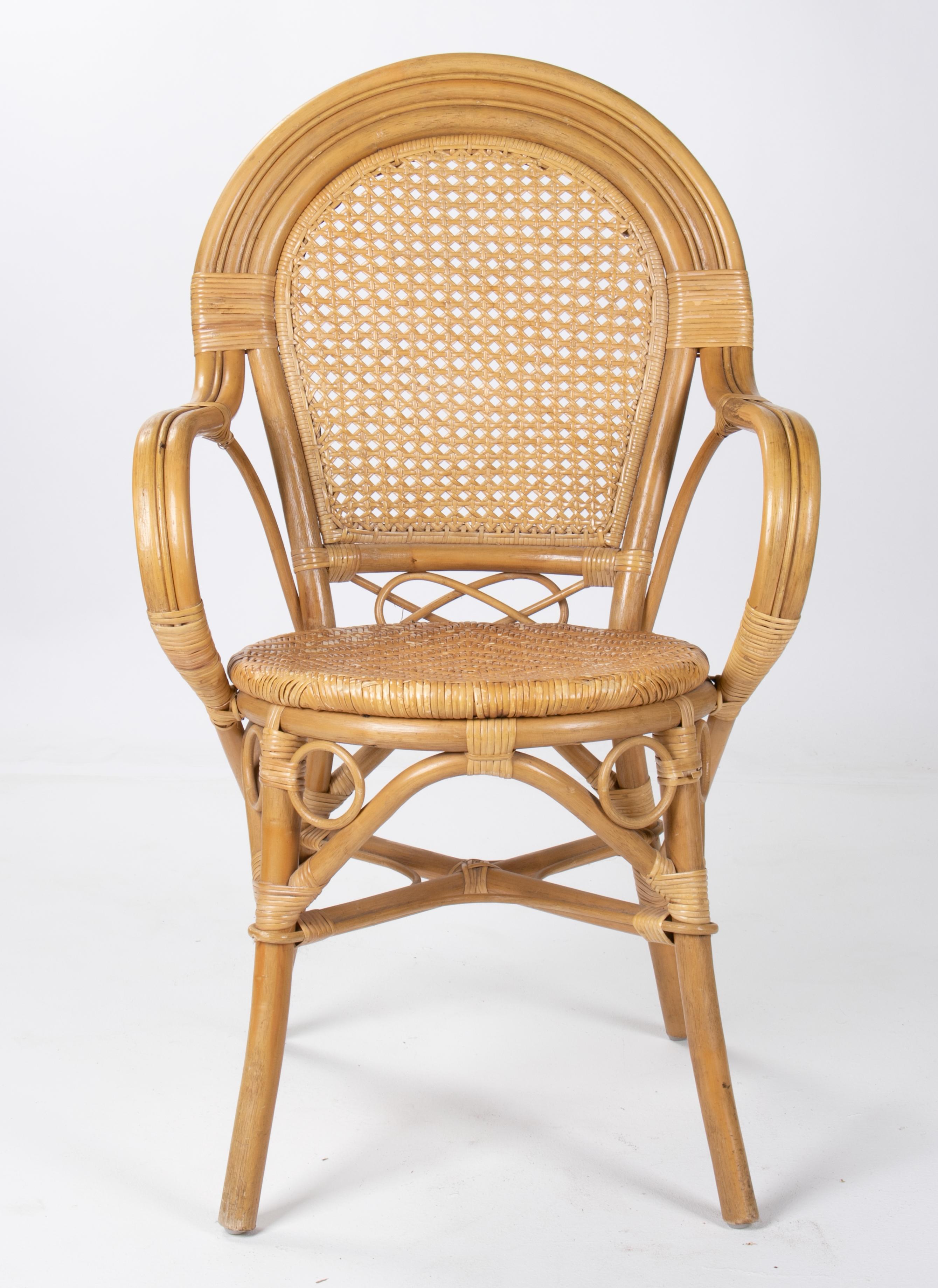 1970s set of four Spanish bamboo and wicker armchairs.