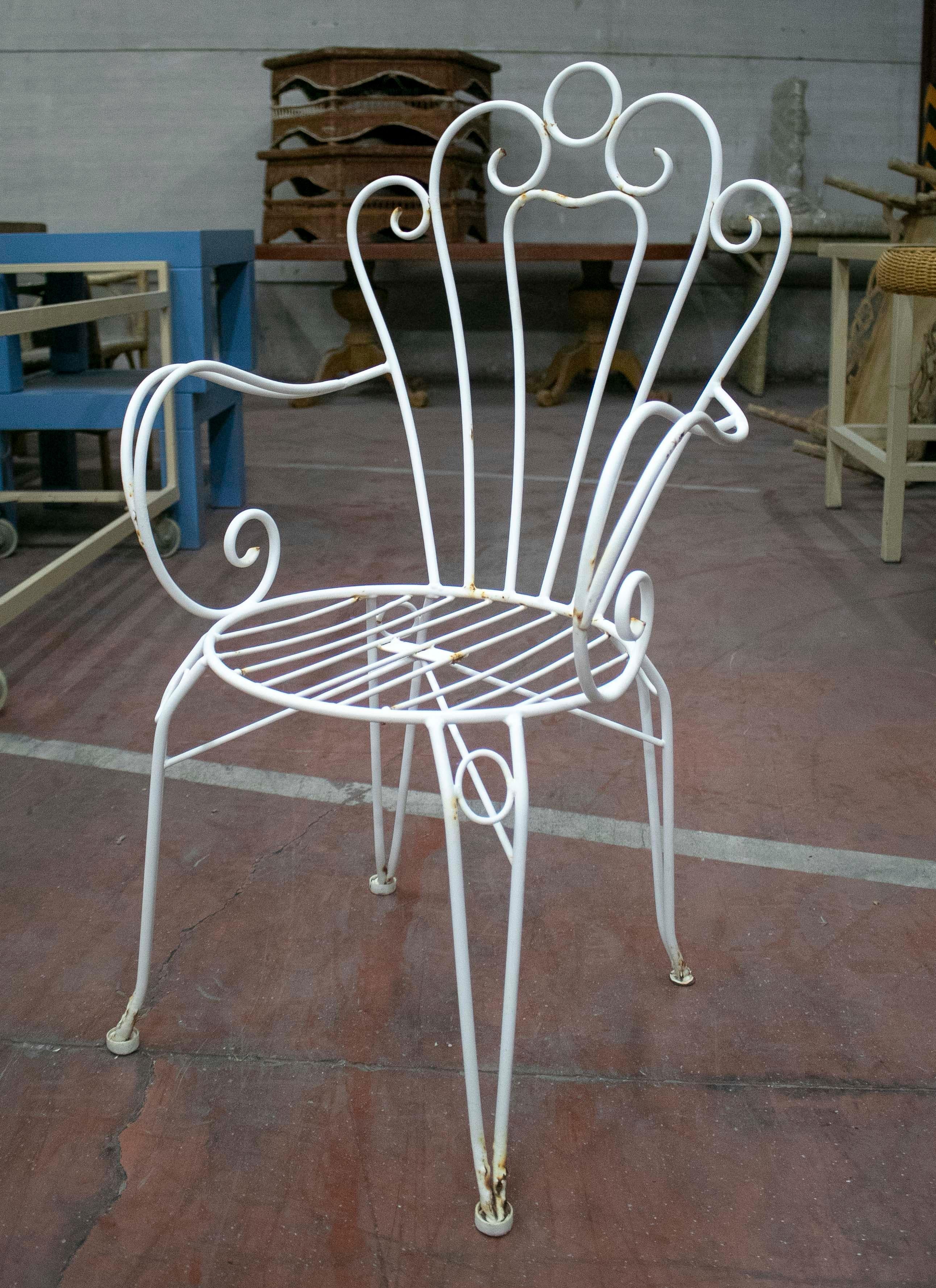 1970s set of four Spanish iron garden armchairs.