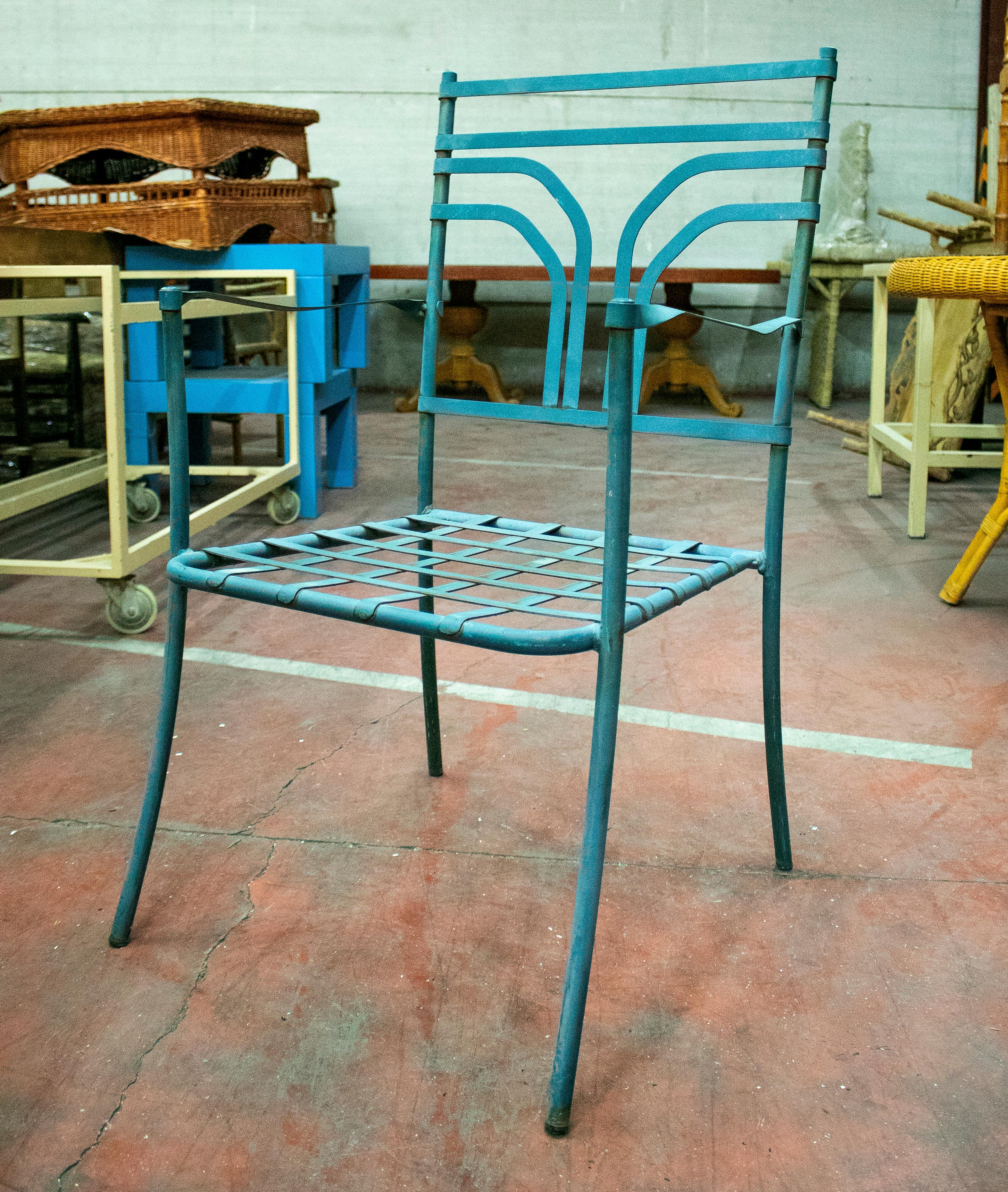 1970s set of four Spanish iron garden armchairs.