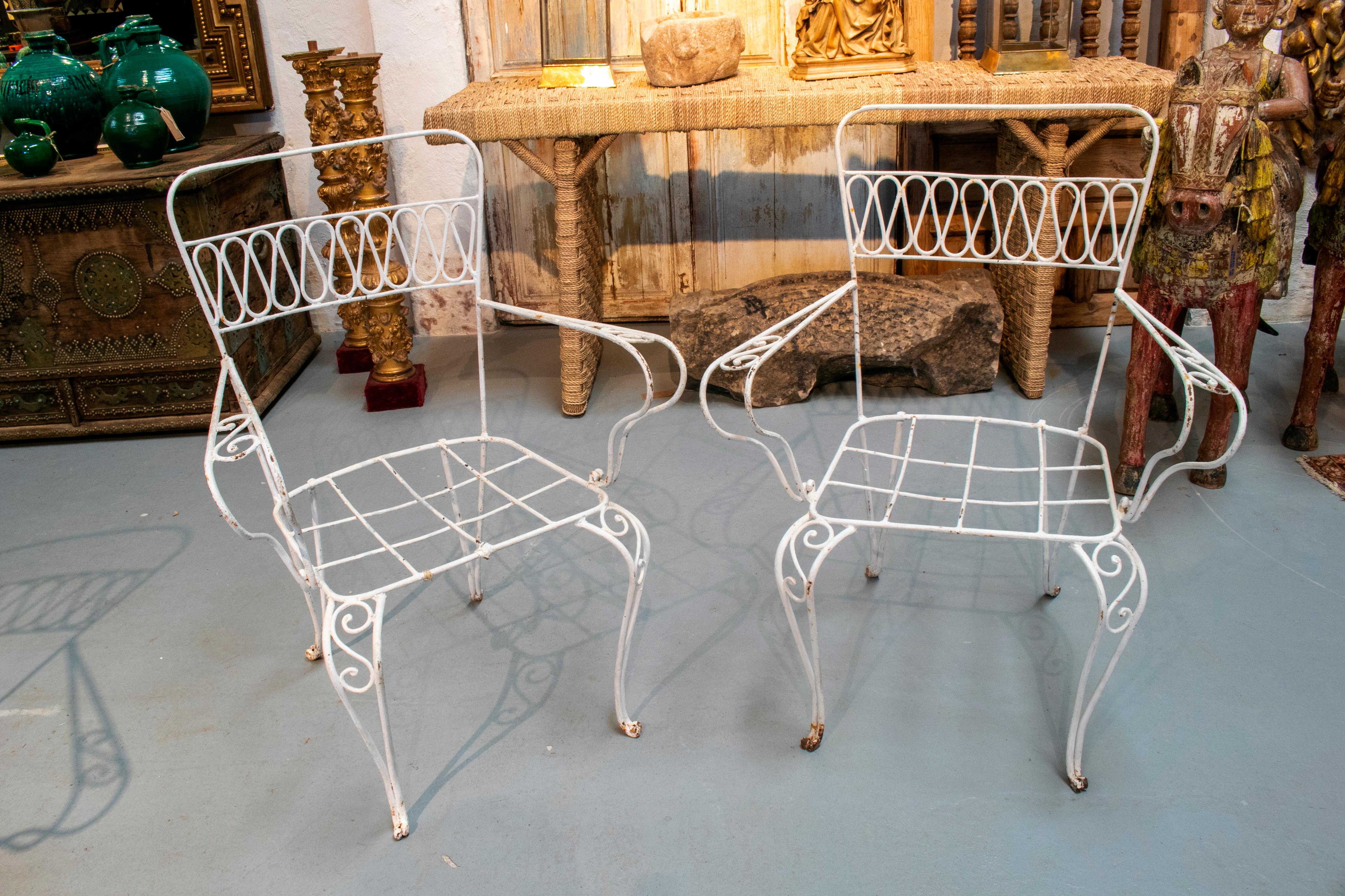 European 1970s Set of Four Spanish White Painted Iron Garden Chairs
