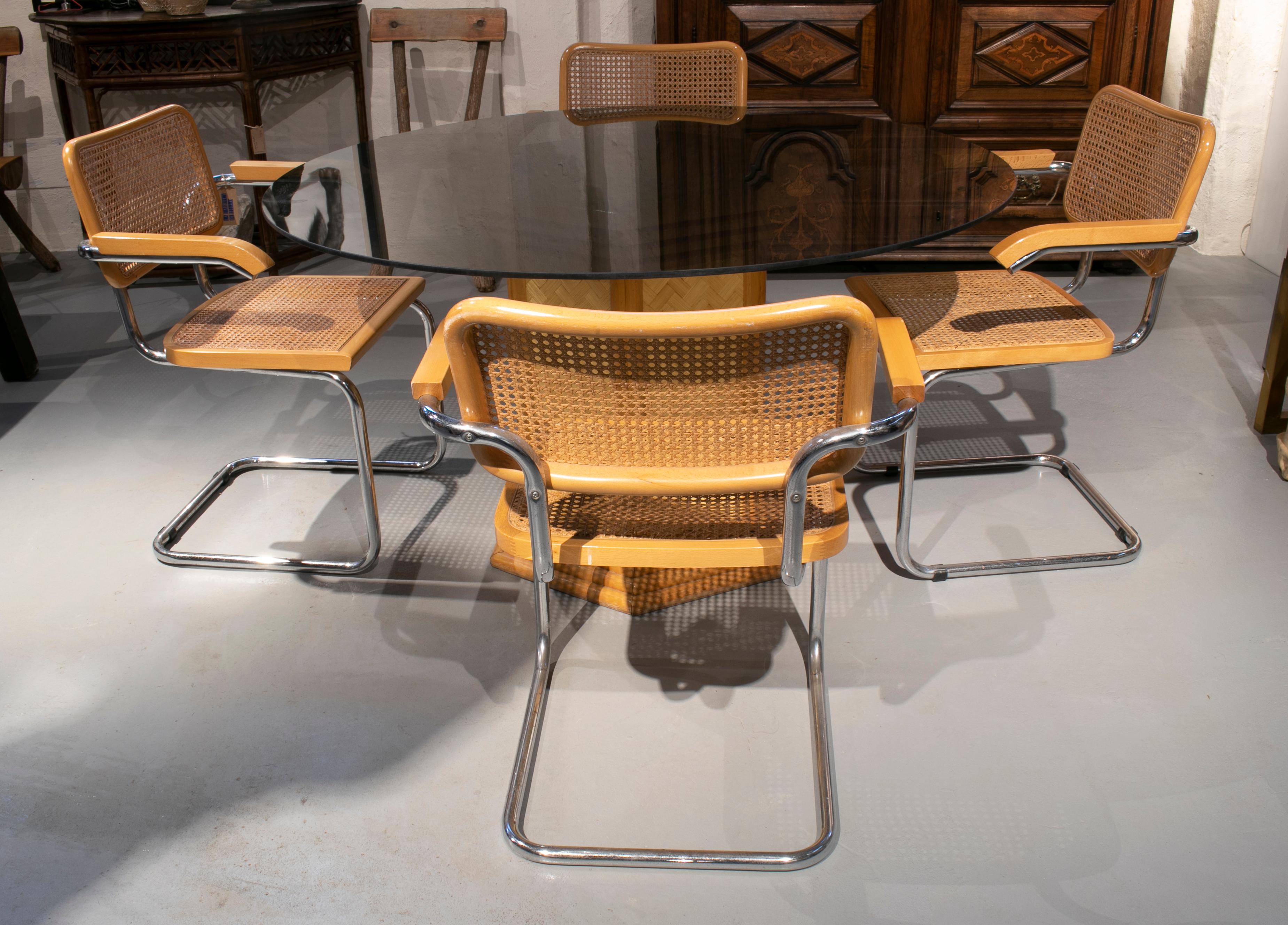 1970s set of Italian bamboo and crystal table with four Cesca chairs.

Armchairs measurements: 81 x 61 x 56cm
Table measurements: 74 x 130cm.