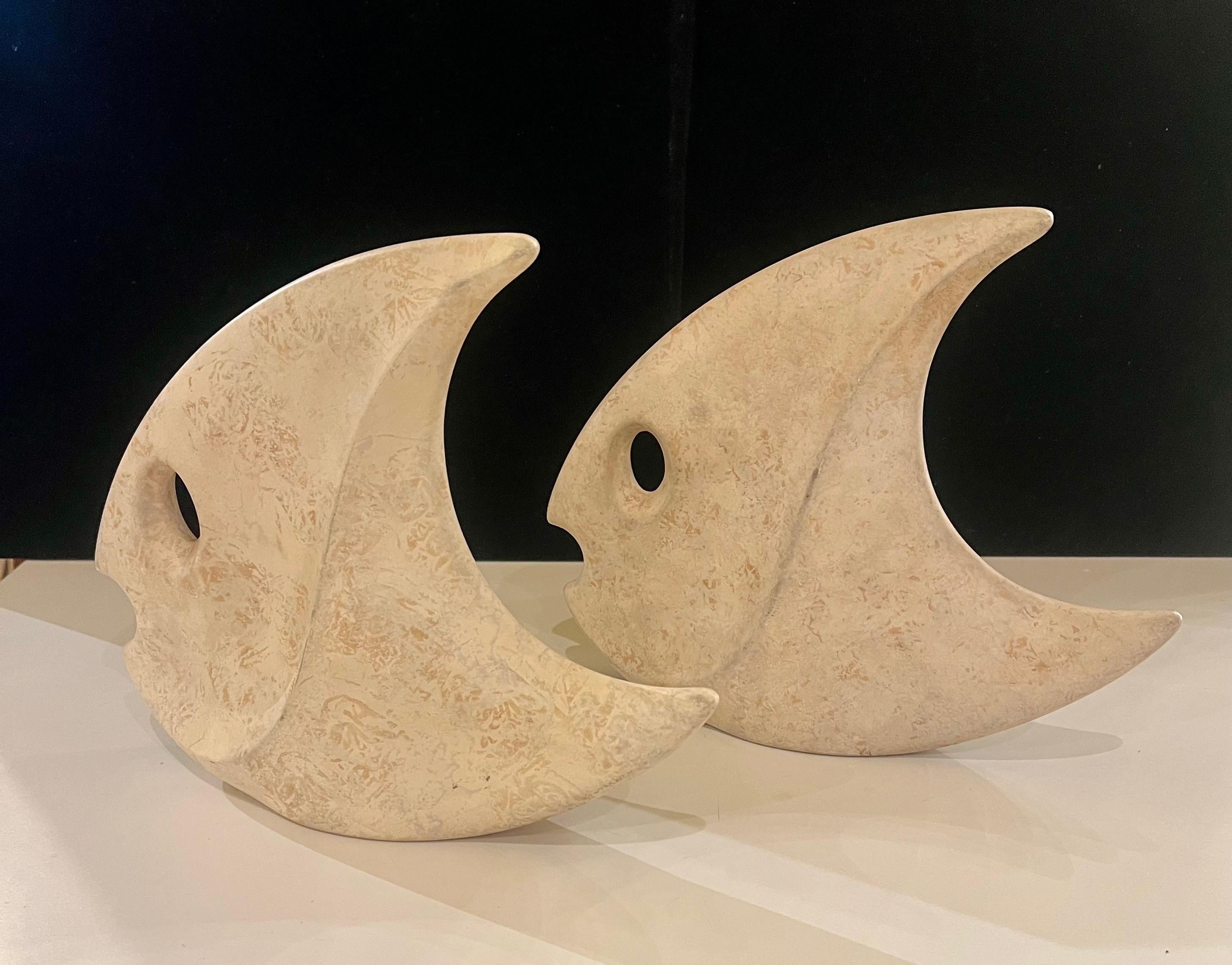 rare pair of modernist fish ceramic sculptures in a textured finish , with a travertine style color , circa 1970's made by Jaru of California very nice and clean condition , a very rare set to find great with Mid Century , Modernist Space age home