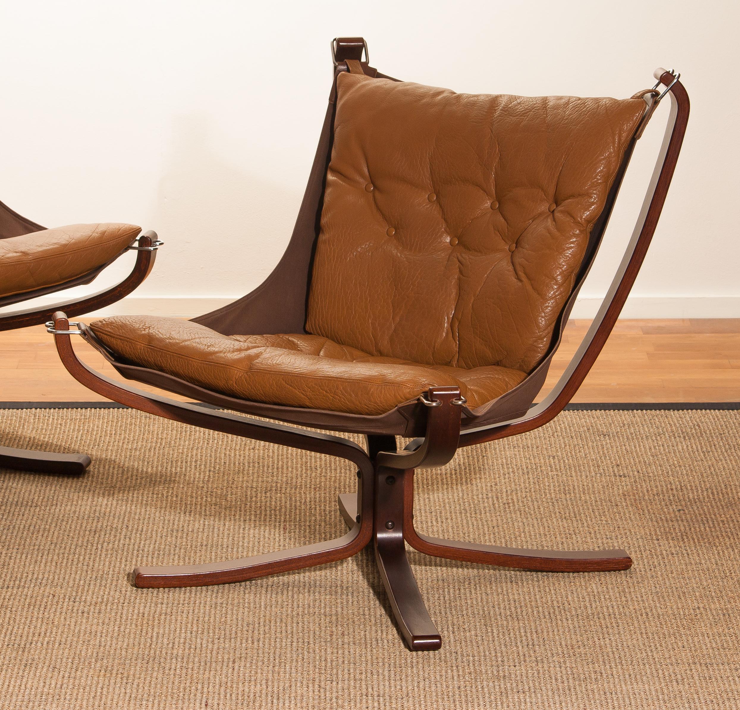 Extremely beautiful set of three lounge chairs / easy chairs. All designed by Sigurd Ressell Norway.
The three chairs are in very good original condition. 
The camel leather seating as the wooden frames are all in perfect condition.

Period