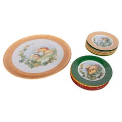 Set di dodici piatti decorativi di Laure Japy degli anni '70 con motivi di formaggio e frutta