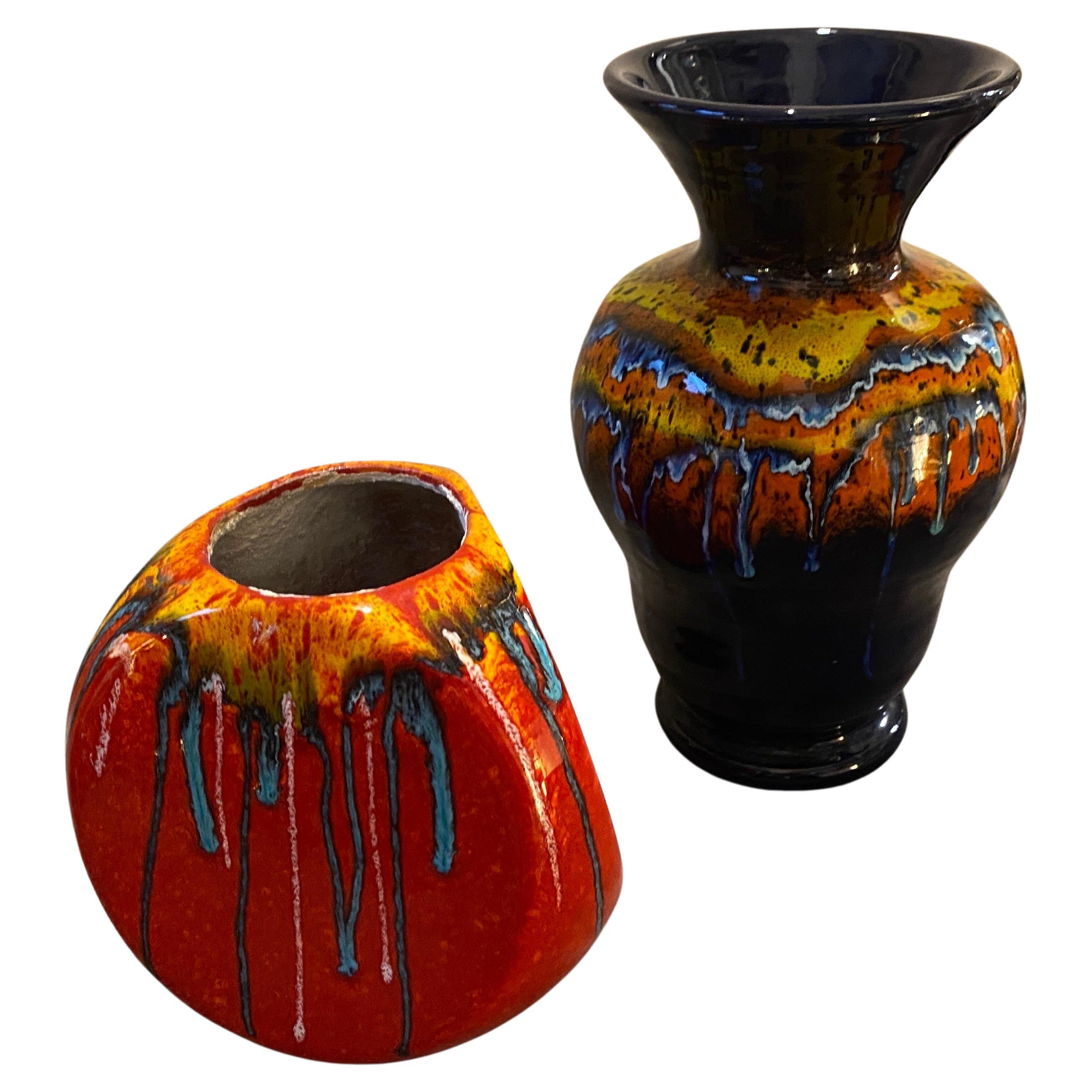 Two ceramic Italian vases in perfect condition, designed by Roberto Rigon and manufactured by Bertoncello. They are a vibrant and striking example of the fusion between artistic expression and functional design that characterized this era. Designed