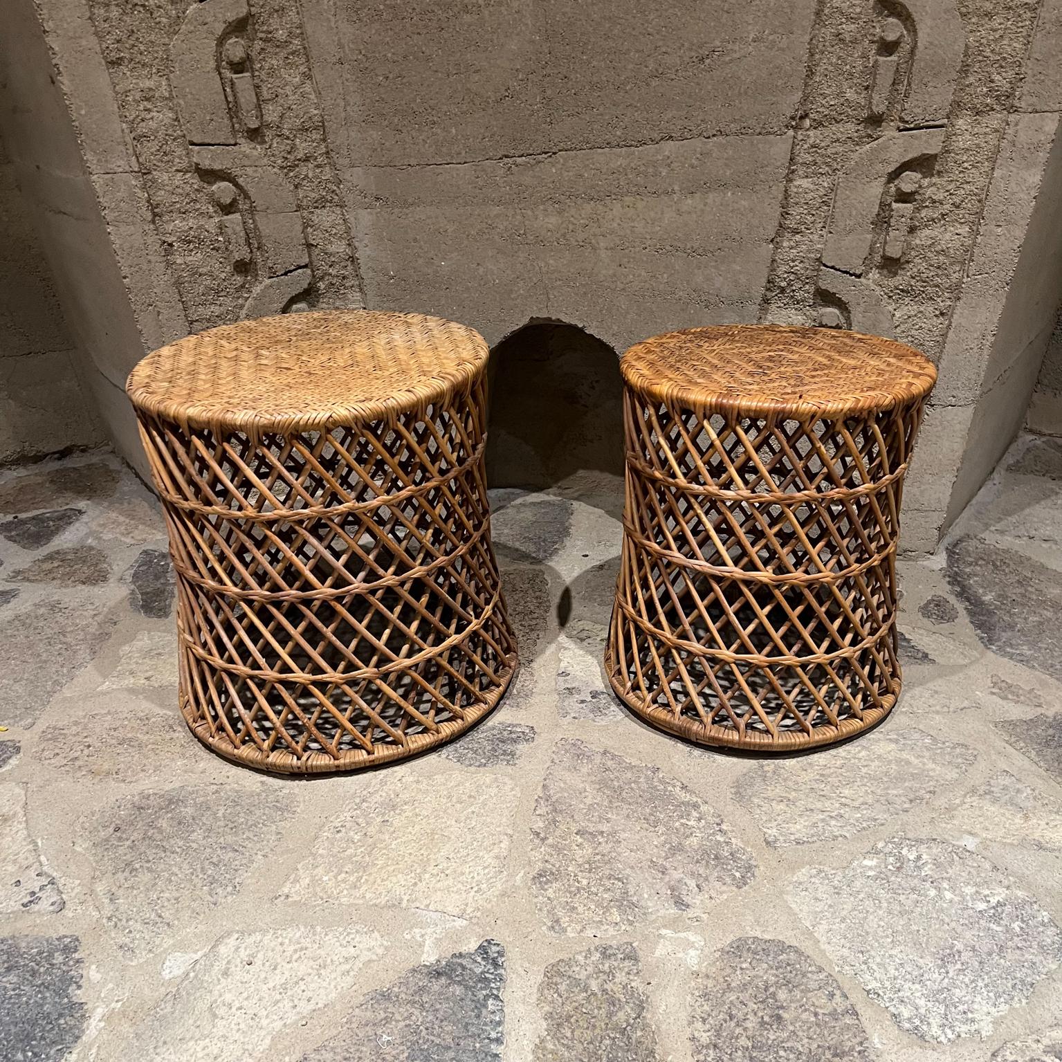 Set of two midcentury cane nesting tables vintage modern 
Unmarked, in the style of Franco Albini
Measures: Large 18 tall x 16.5 diameter, Small 17 tall x 14 diameter
Preowned original unrestored vintage condition.
Refer to images
