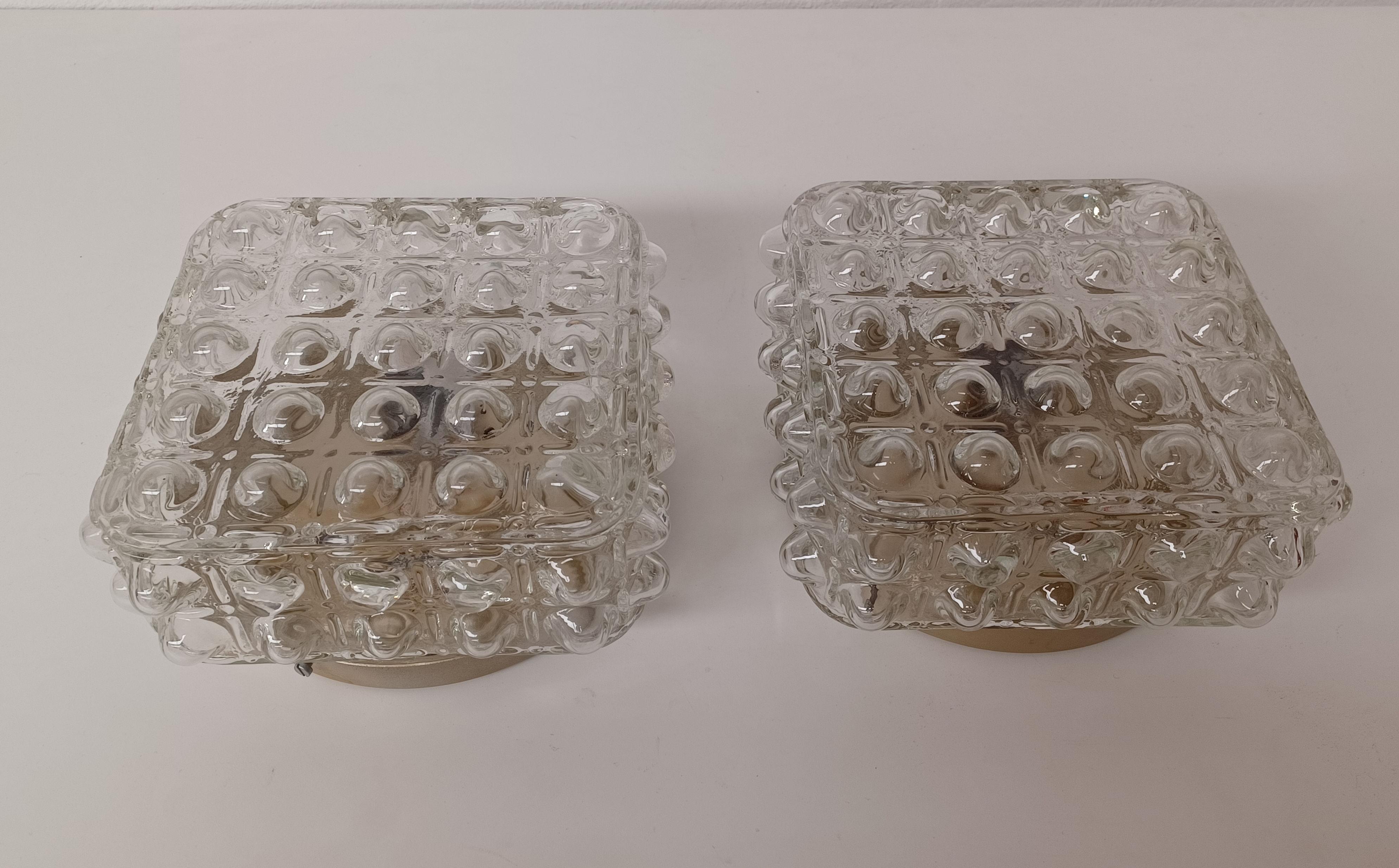 1970's Restored and rewired Danish flush mounts in glass 

The flush mounts were manufactored by E. Horn A/S in Aalestrup feature a completely rewired 1 light fixture  with a large thick glass lampshade with a structured surface on the outside.

The