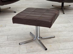 1970s, set of two swivel lounge chairs with footstool, leather.