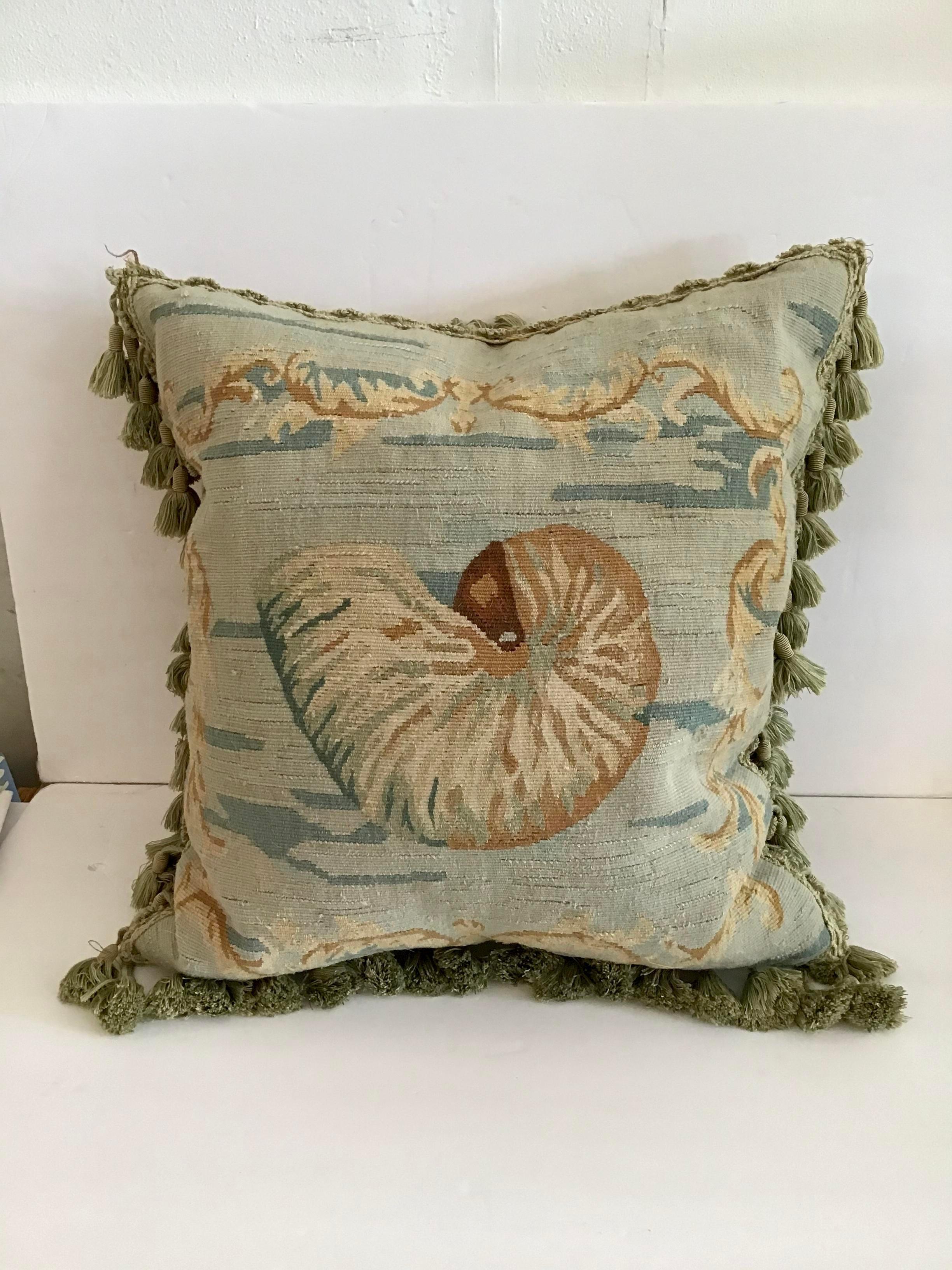 Gorgeous handwork on this Aubusson down pillow with decorative fringe. Add some chic style to your decor.