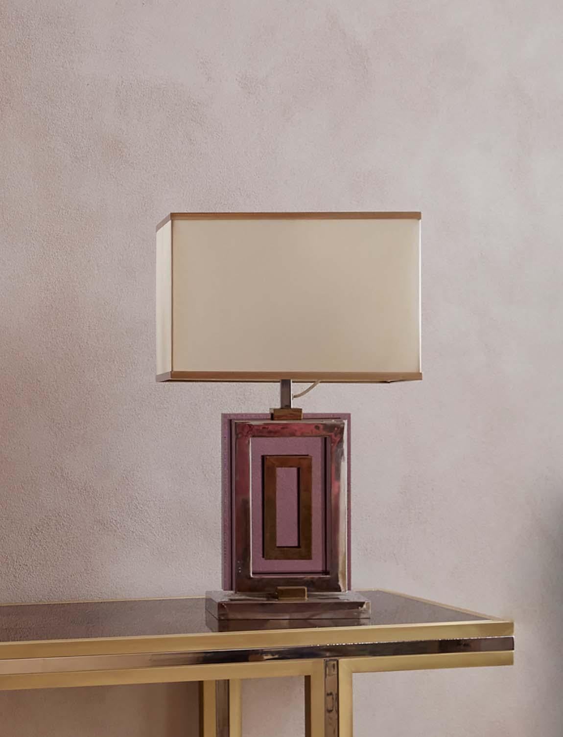 An extraordinary signed Romeo Rega desk lamp found in a private home in Narni. The lamp base is made with Rega's signature brass, chrome and a type of pink plexiglass. We have restored the lampshade in Florence with our expert artisanal lampshade