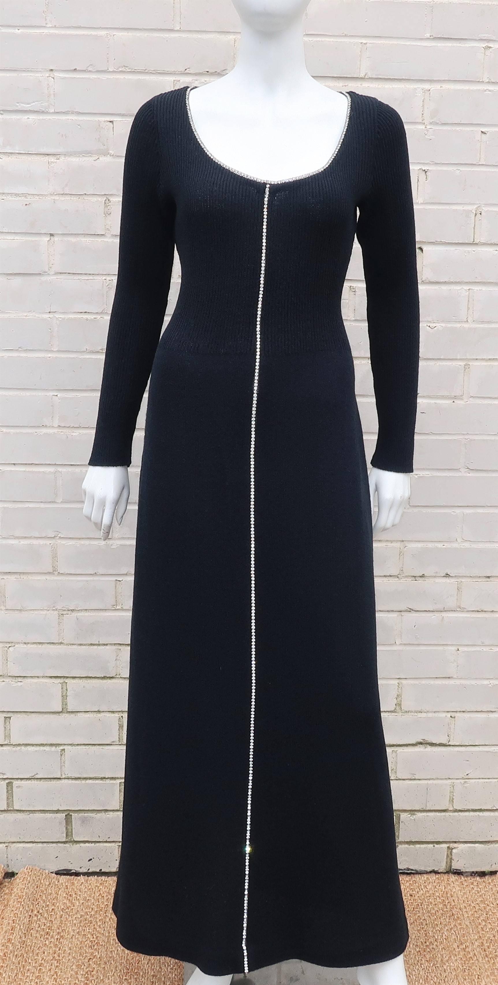 Show off your best assets with this easy-to-wear 1970’s black body conscious knit evening dress embellished with sparkly rhinestones.  The dress zips and hooks at the back in a fabric similar in weight and feel to the rayon knitwear favored by the