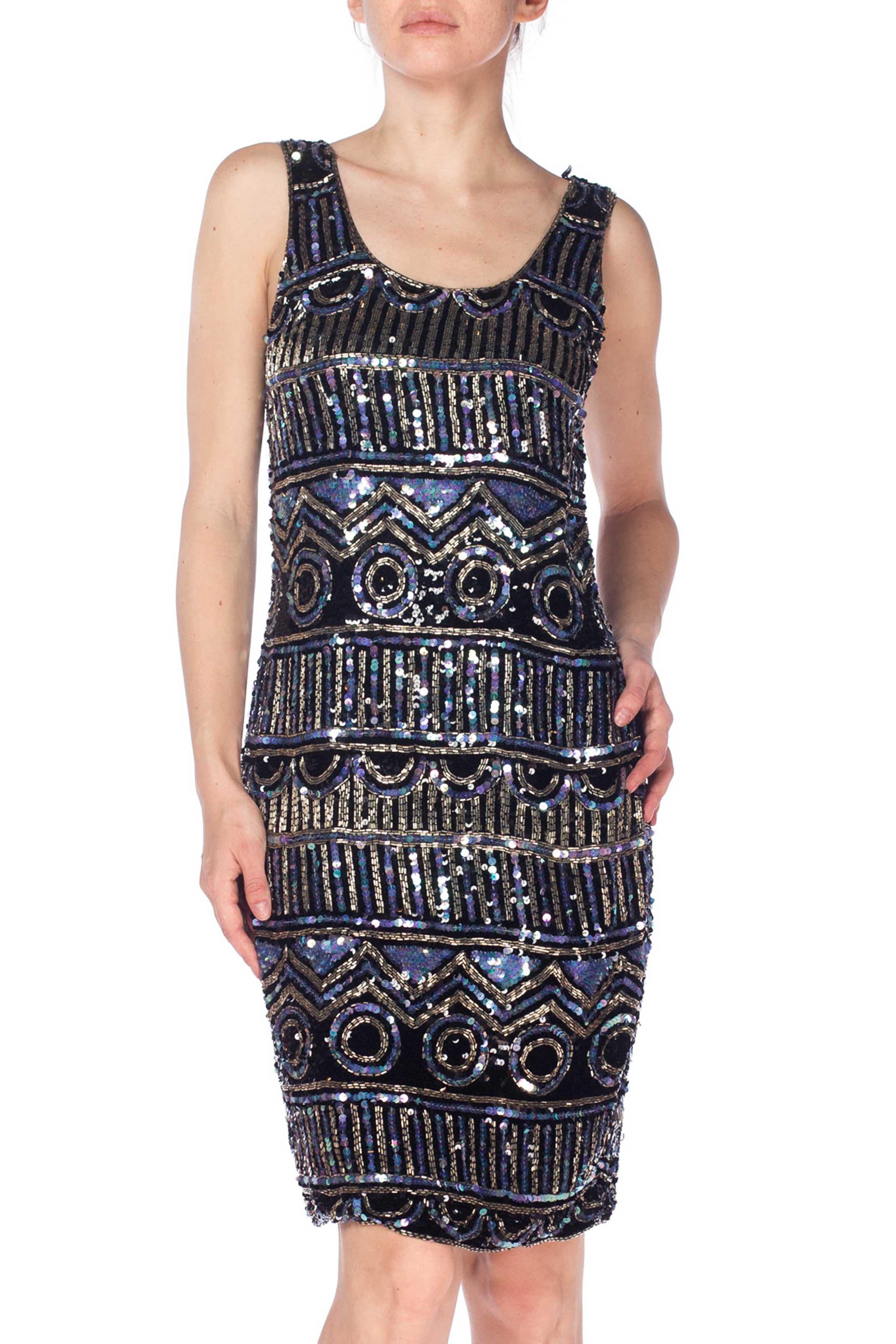 Lined in rayon, has a few loose beads but otherwise in great shape 1990S Black Silk Chiffon Cocktail Dress  Fully Beaded In Silver, Blue, And Sequins 
