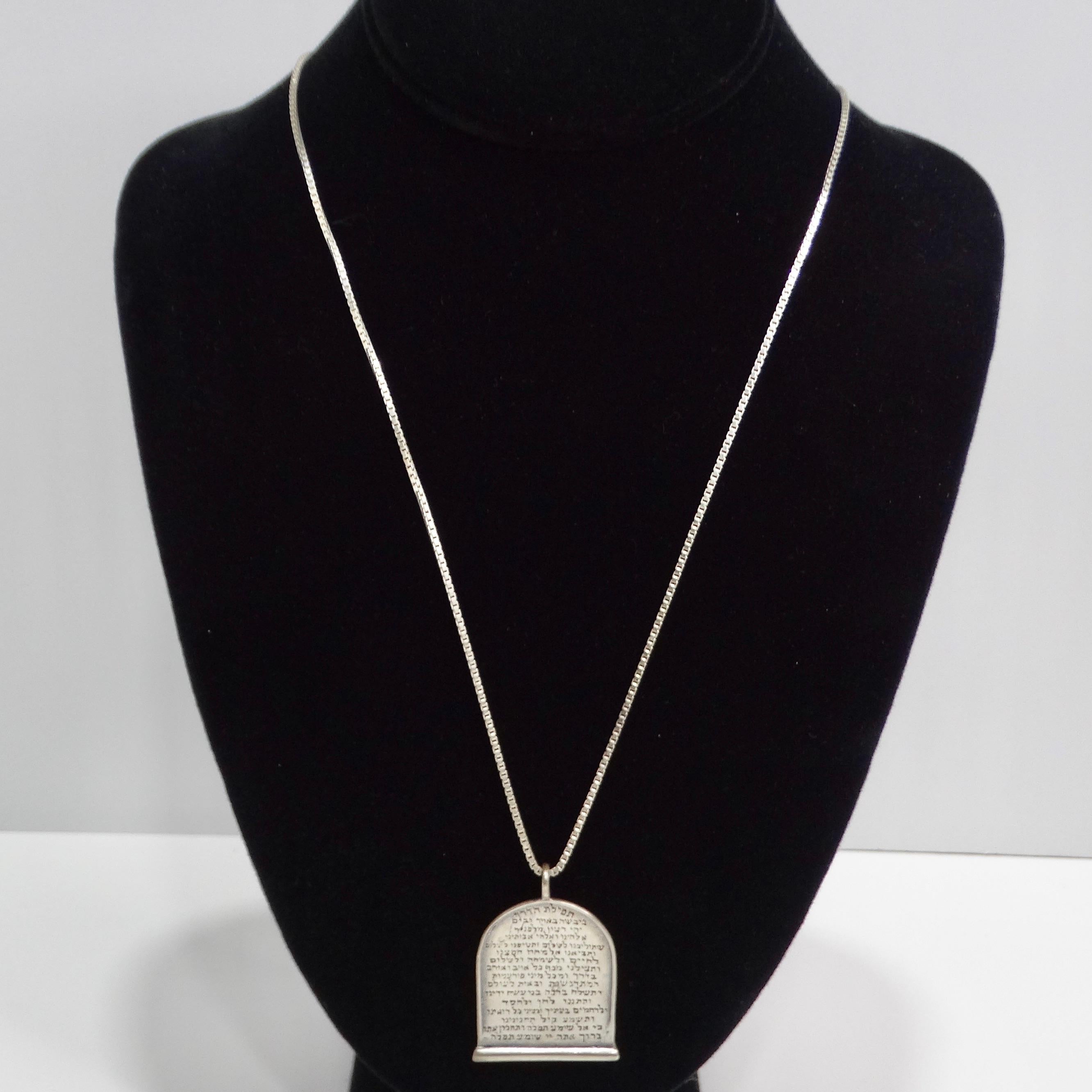 Introducing the 1970s Silver Hebrew Blessing Necklace, a beautiful vintage piece that combines luxury with spiritual significance. This necklace is crafted from high-quality silver 925 and features a pendant inscribed with the Hebrew text of the